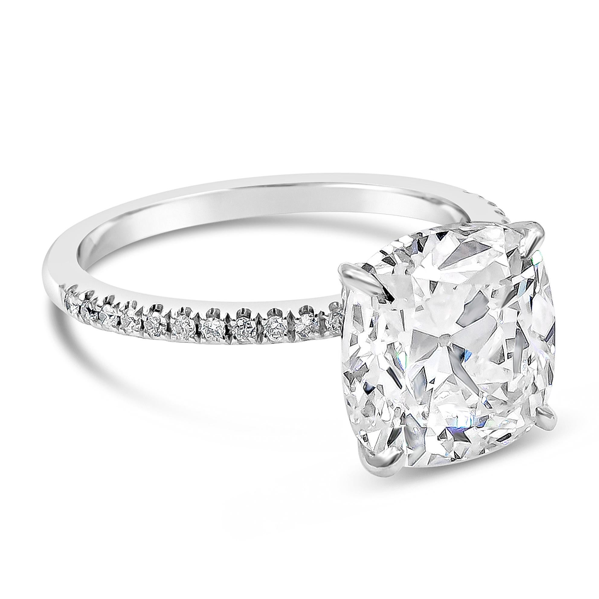 A classic engagement ring style showcasing a 4.68 carats cushion cut diamond center stone certified by GIA as K color and VS2 in clarity. Set in a very thin, platinum band accented with diamonds and Finely made in 14K white gold and platinum.

Roman