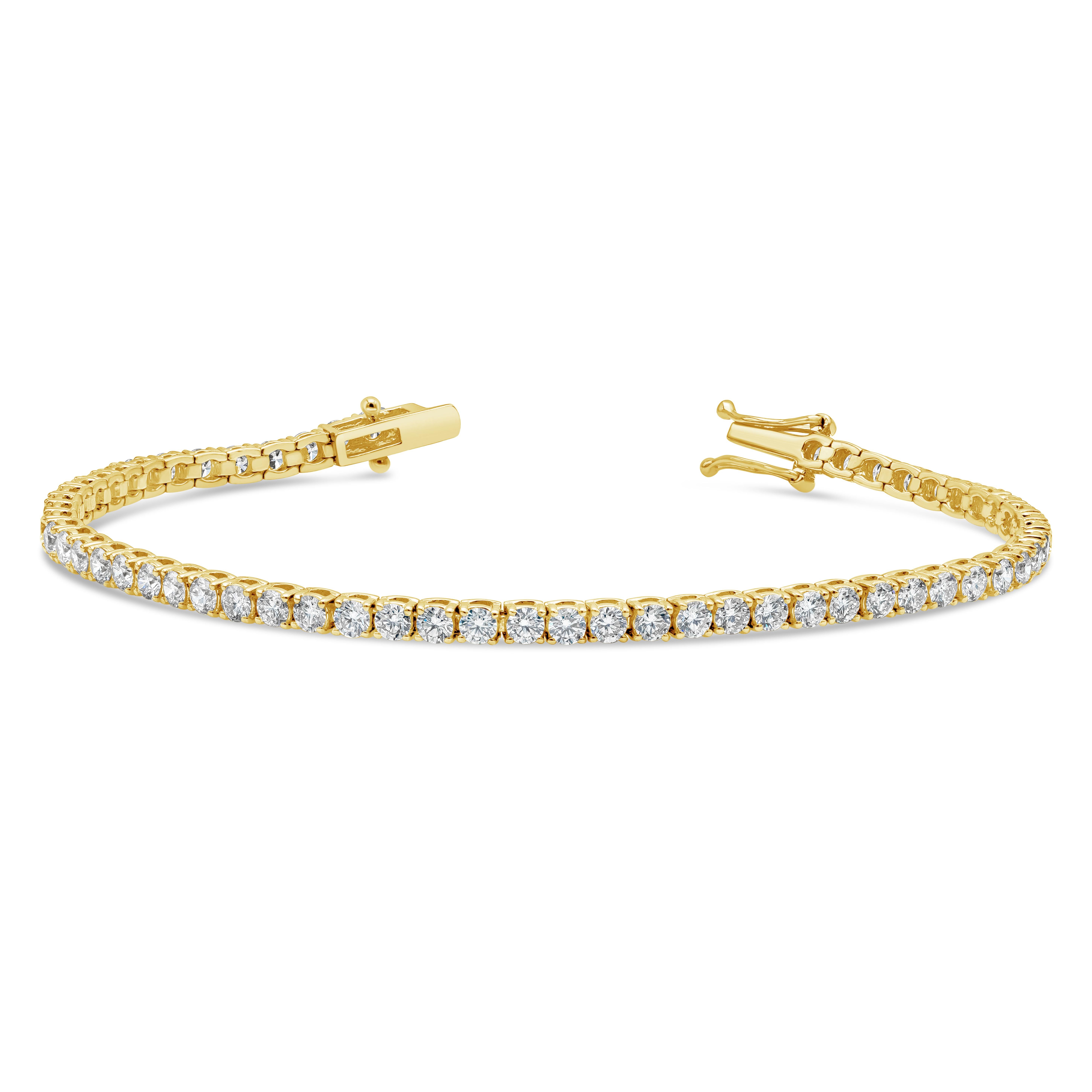 ﻿A classic tennis bracelet style showcasing 58 round brilliant diamonds weighing 4.70 carats total, F-G  Color and SI in Clarity. Made with 18K Yellow Gold. 2.80mm Width and 7 inches in Length. 

Roman Malakov is a custom house, specializing in
