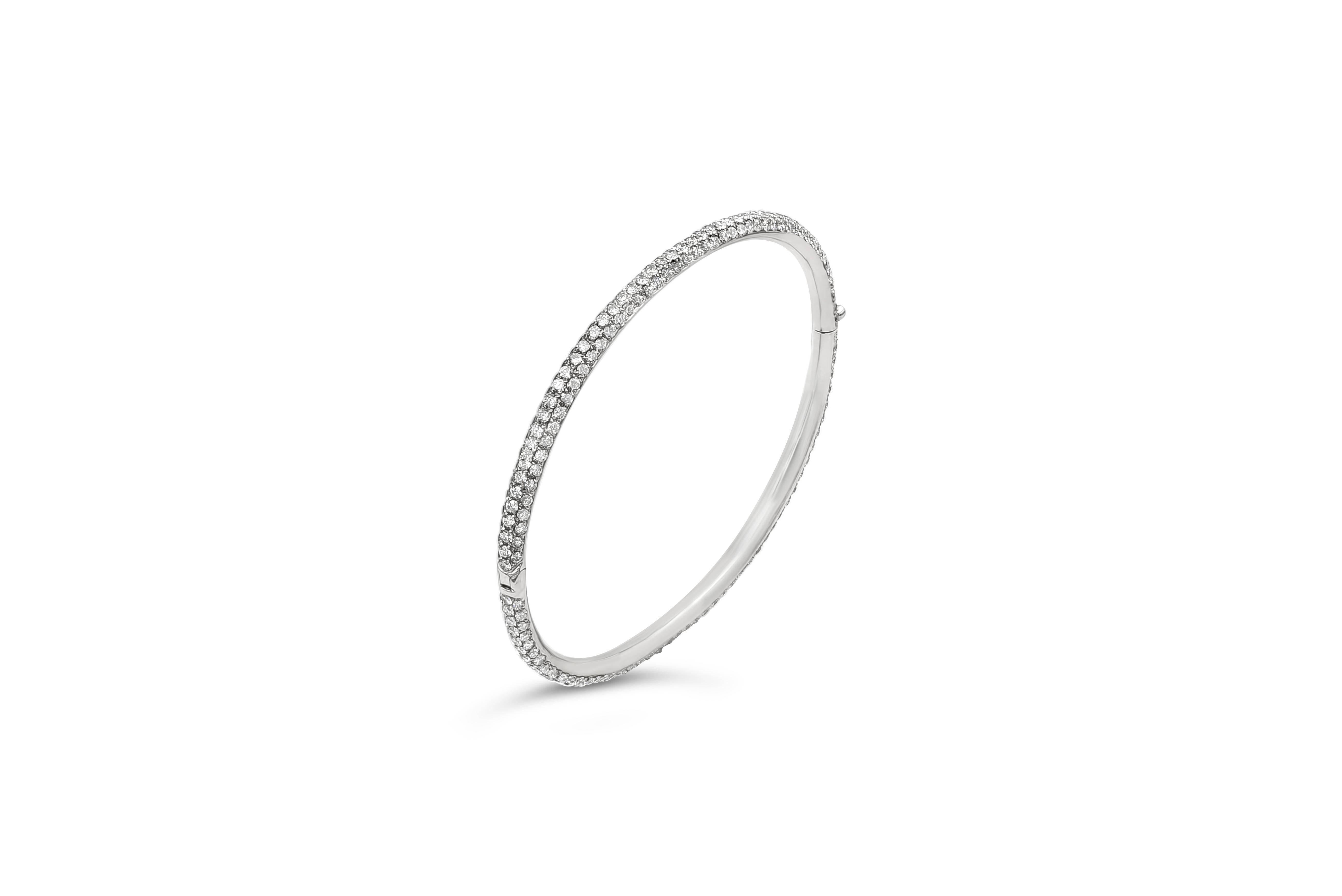 A classic bangle bracelet encrusted with 293 round brilliant diamonds pave set weighing 4.76 carats total. Made with 18K White Gold. 

Roman Malakov is a custom house, specializing in creating anything you can imagine. If you would like to receive a