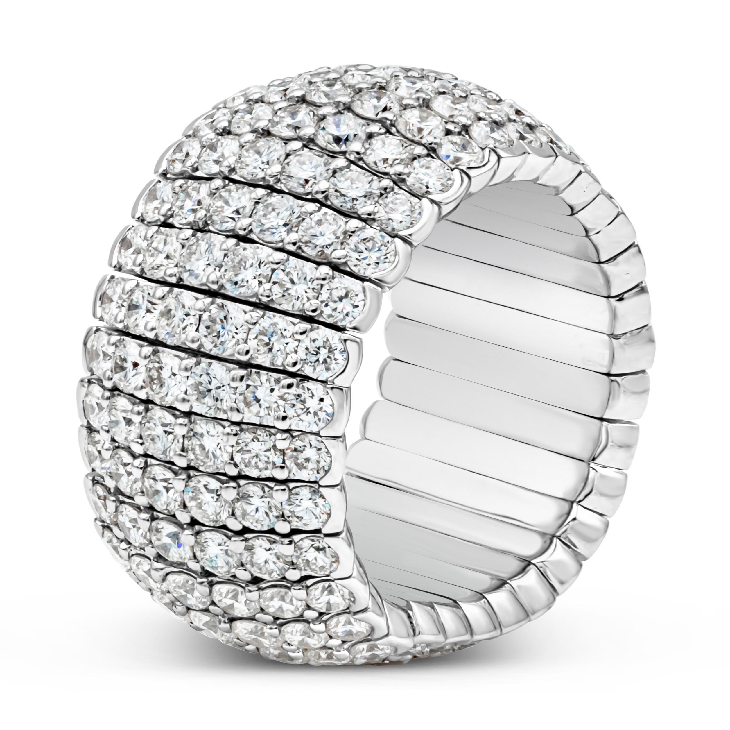 This fashionable and vibrant flexible fashion ring showcases six rows of 192 brilliant round cut diamonds weighing 4.92 carats total, set in a beautiful micro-pave set and shared prong setting. Finely made in 18k white gold. Size 6.5 US resizable