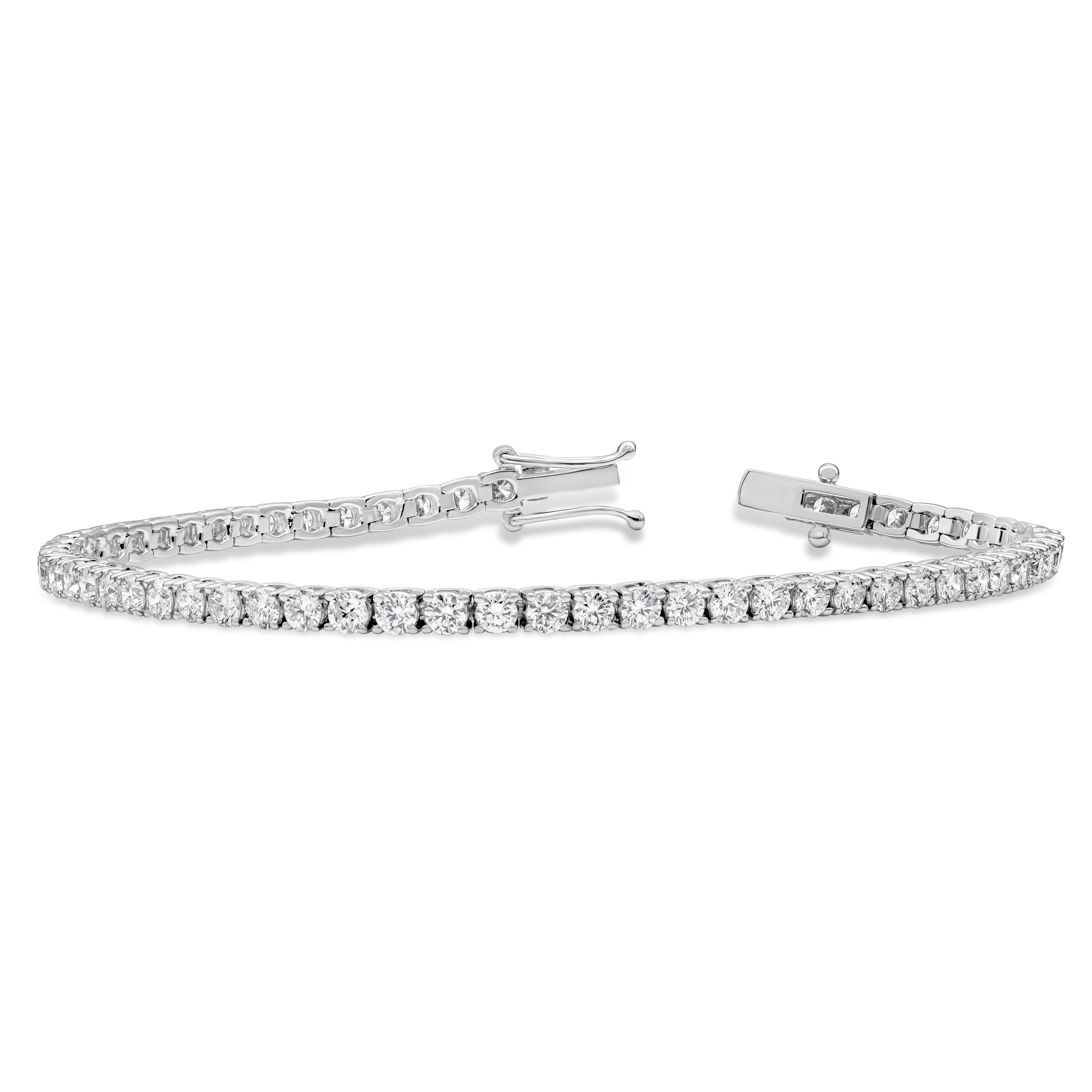 A classic tennis bracelet style showcasing 58 round brilliant diamonds weighing 4.93 carats total, F color and VS-SI in clarity. 7 inches in Length. 2.80 in Width. Made with 18K White Gold.

Roman Malakov is a custom house, specializing in creating