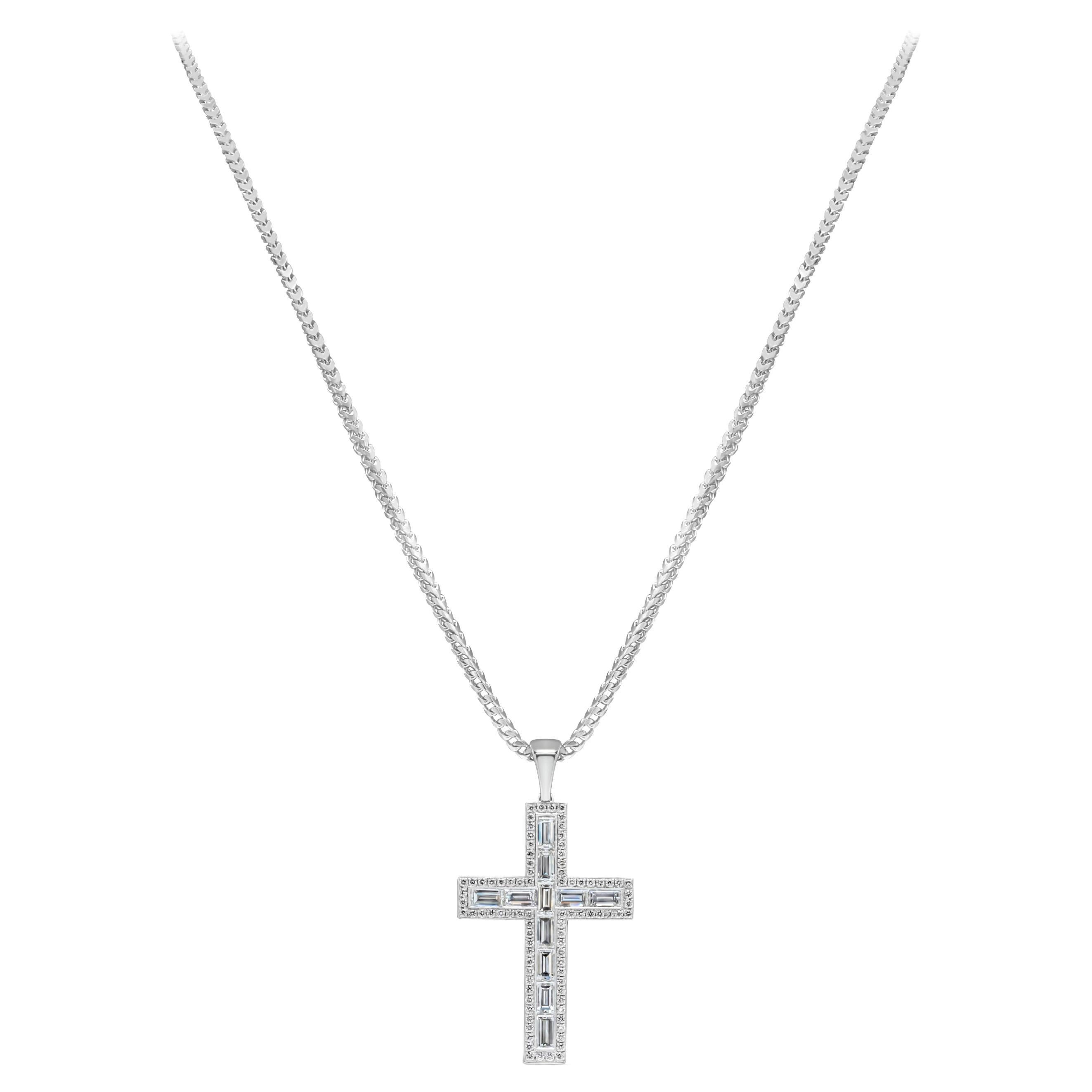 A fascinating religious cross pendant necklace showcasing channel set baguette diamonds weighing 4.10 carats G Color and VS+ in Clarity, Surrounded by brilliant round diamonds around weighing 0.89 carats, hanging from a 10mm bail, suspended on a