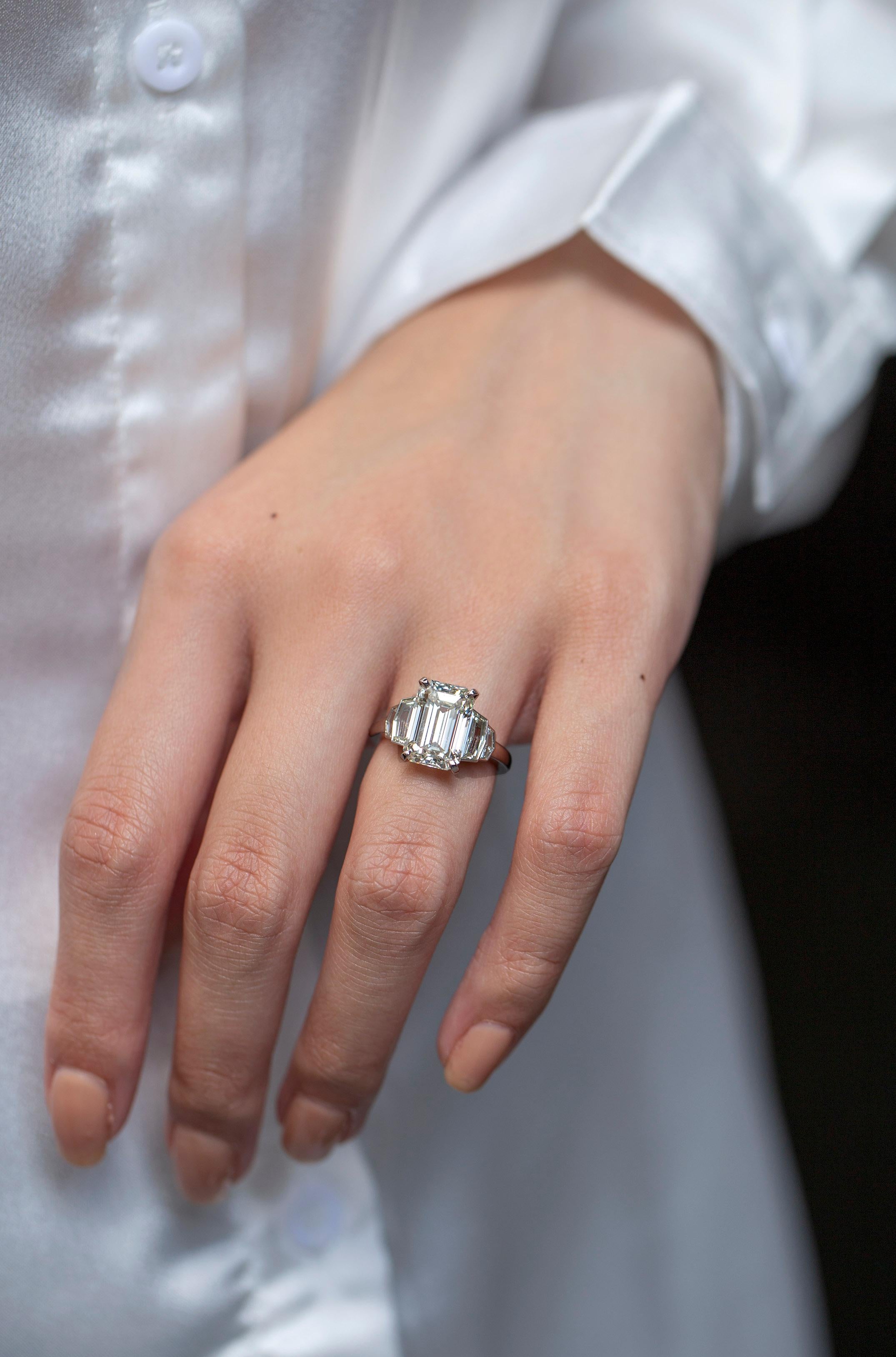 Contemporary GIA Certified 5.01 Carats Emerald Cut Diamond Five-Stone Engagement Ring For Sale