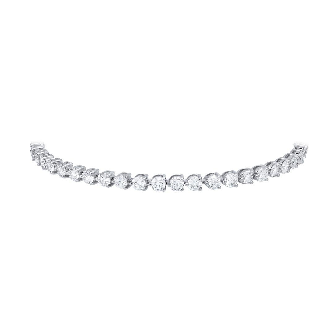 A classic tennis bracelet showcasing 46 brilliant round cut diamonds weighing 5.17 carats total. Each stone is set on a beautiful three-prong setting. Finely made with 14K white gold and measures 7 inches in length. 

Roman Malakov is a custom