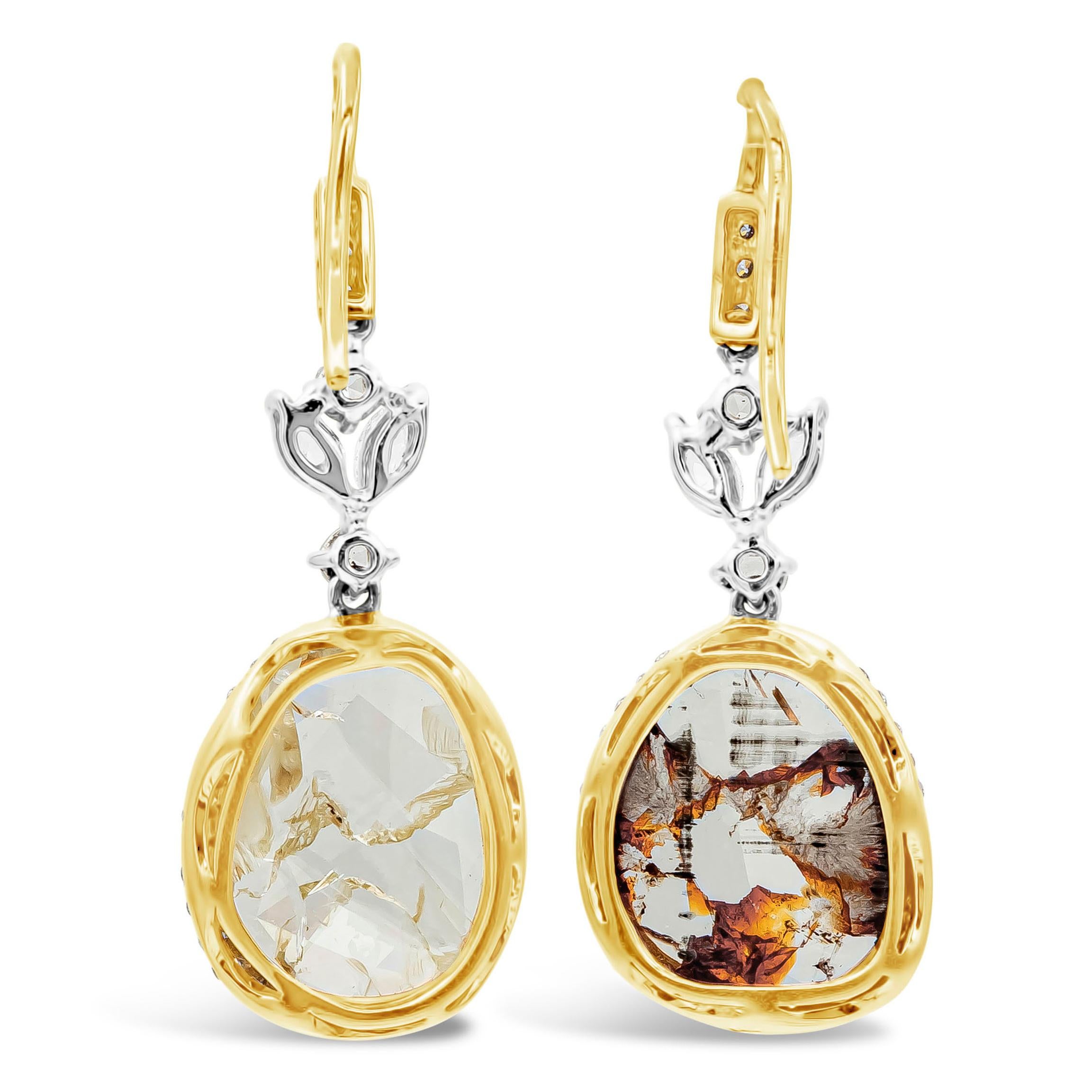  A beautiful, special and intricately-designed pair of dangle earrings showcasing an 18K tricolored design, set with diamond slices weighing a total of 4.22 carats and a brilliant round diamonds that weighs 1.05 carats total.

Roman Malakov is a