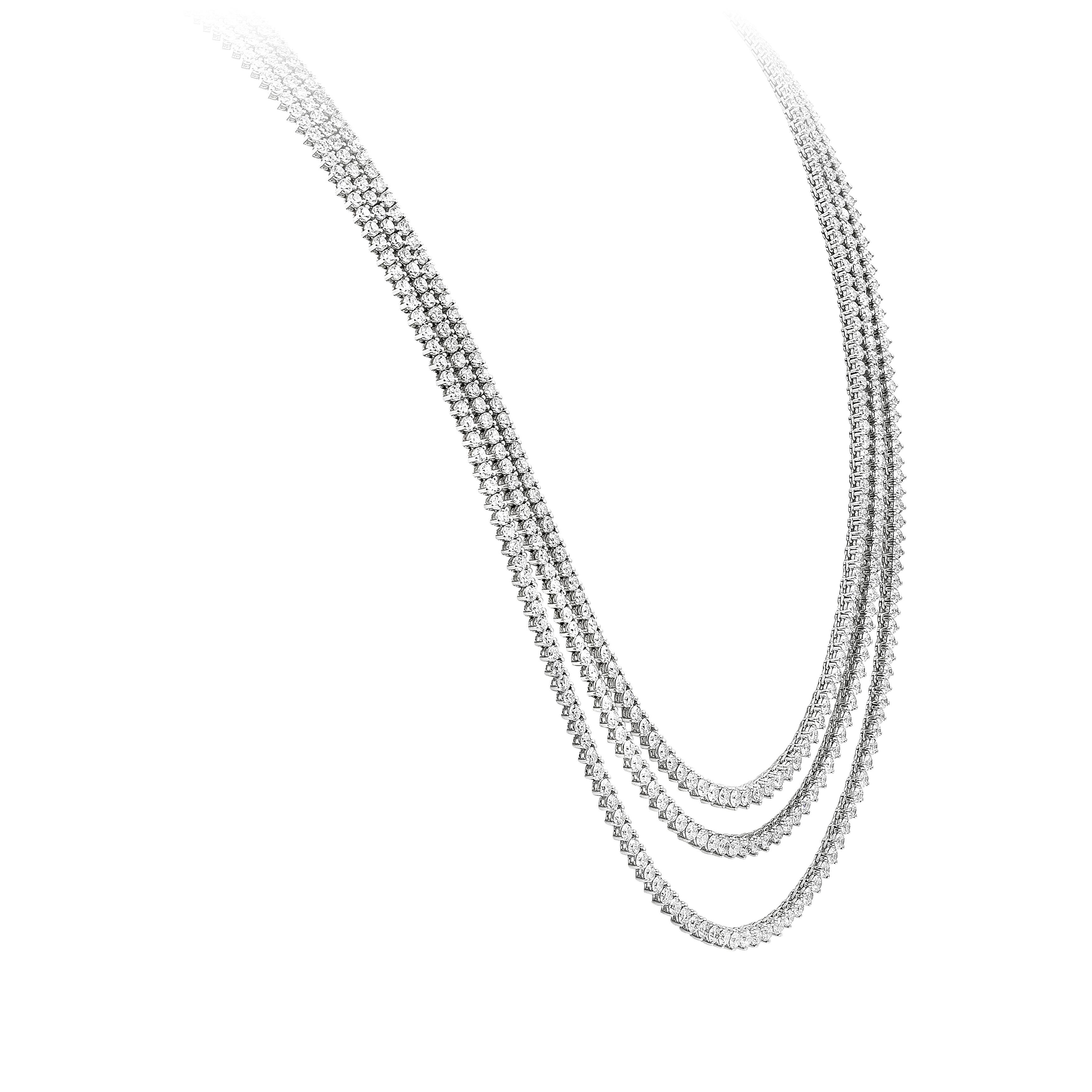 An important and beautiful multi-row tennis necklace showcasing three-rows of graduating lengths, set with round brilliant diamonds weighing 54.16 carats total. Each diamond is set on a chic three-prong basket setting and made in 18K white gold.