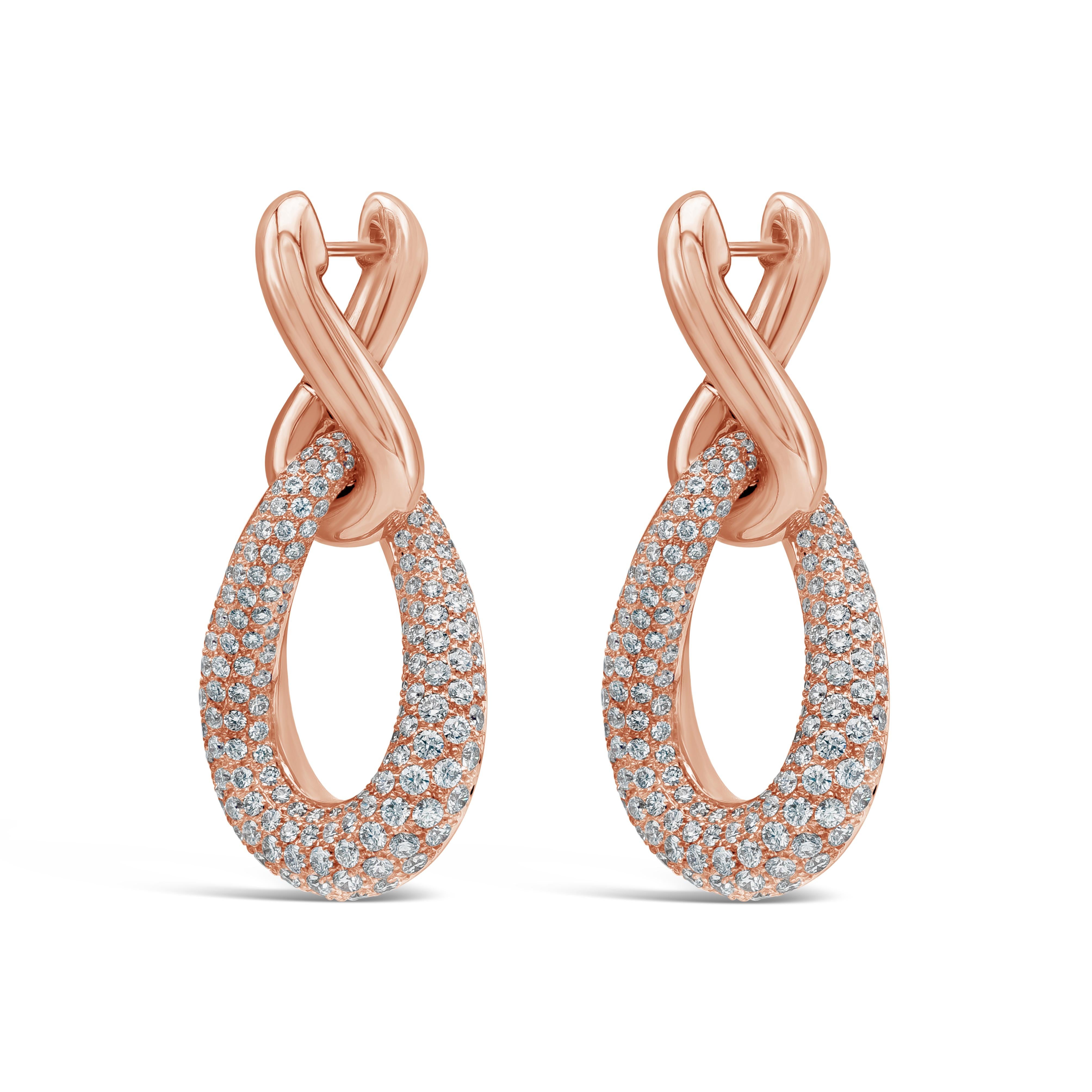 A stylish pear shape drop earrings showcasing round brilliant diamonds weighing 5.68 carats total. F color and VS in Clarity. Set in an intricately intertwined designed mounting made in 18k Rose Gold.  

Roman Malakov is a custom house, specializing