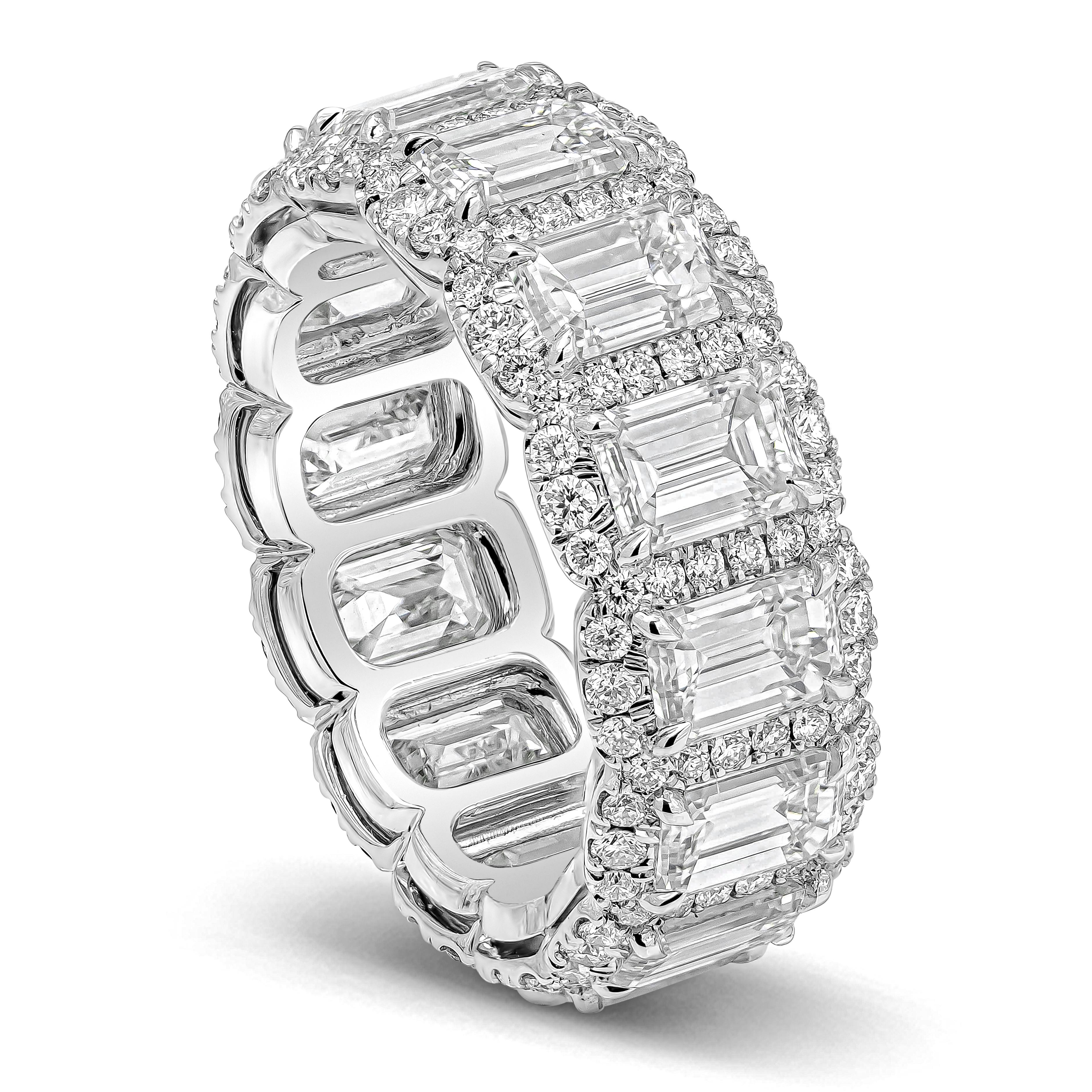 A beautiful and unique eternity wedding band, showcasing a row of emerald cut diamonds weighing 5.73 carats total with F color and VS clarity. Surrounded by a row of round brilliant diamonds weighing 0.94 carats total. Made with platinum. Size 6 US,