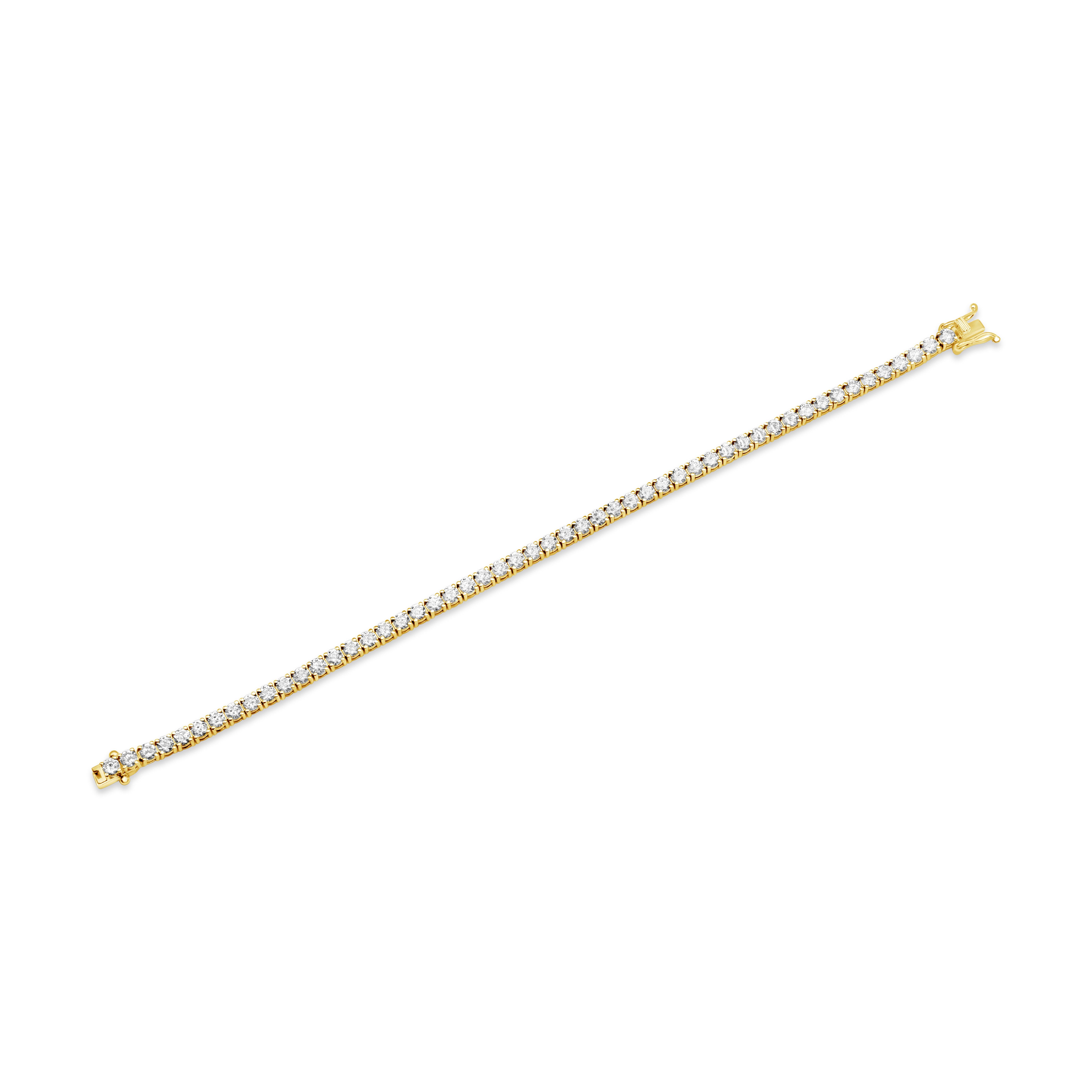 A classic tennis bracelet, showcasing one row of round brilliant cut diamonds weighing 5.78 carats total with G color and SI clarity, each set on a four prong setting. Finely made with 14K yellow gold. Perfect for casual wear. 

Roman Malakov is a