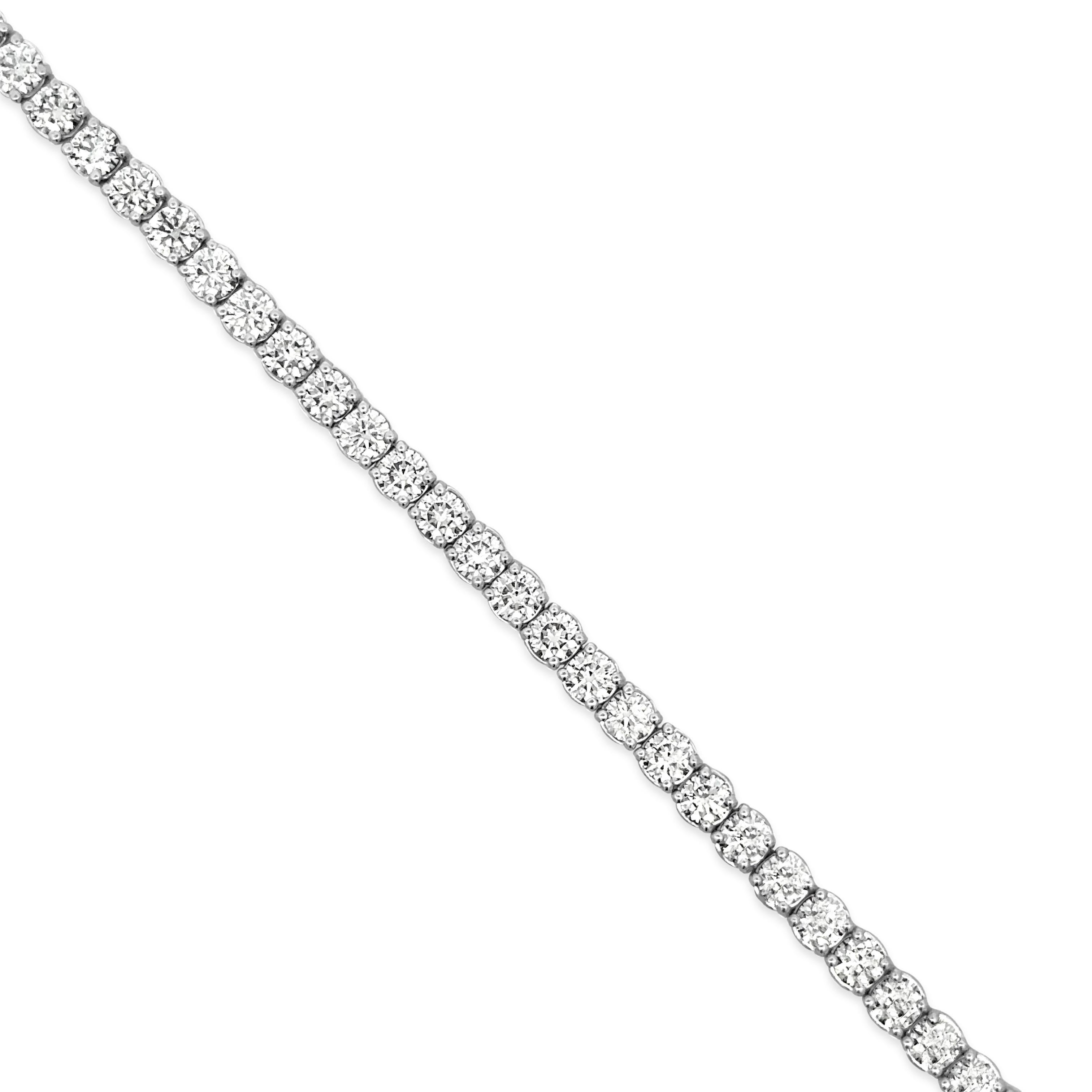 A stunning tennis bracelet, featuring 51 round brilliant cut diamonds weighing 5.80 carats total with G color and VS clarity. Finely made with 14K white gold, 7 inches in length. Perfect complement to any outfit. 

Roman Malakov is a custom house,
