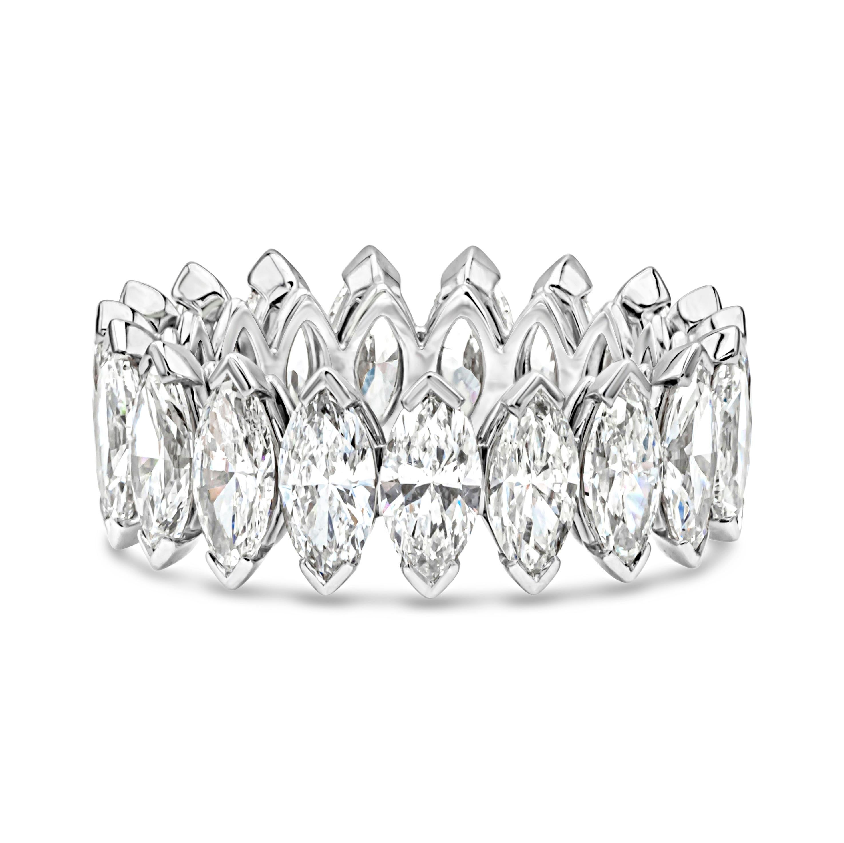 A beautiful and brilliant handcrafted wedding band style featuring a line of 19 brilliant marquise cut diamonds weighing 5.85 carats total, F+ color and VS-SI1 in clarity. Set in a polished platinum mounting and Size 6.5 US resizable upon