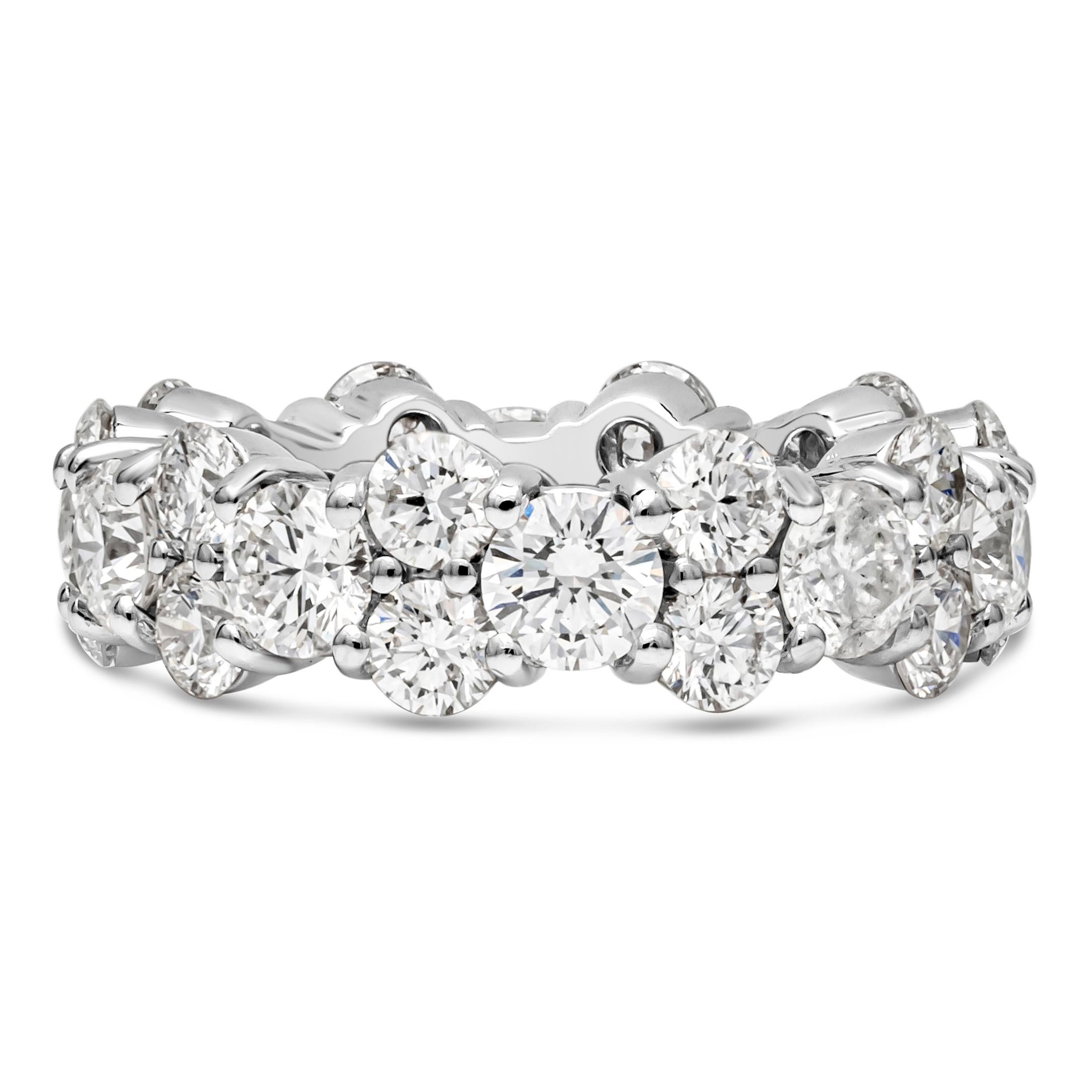 A chic and stylish eternity wedding band showcasing a row of 10 brilliant round cut diamonds weighing 3.05 carats total, that elegantly spaced by 20 smaller round melee diamonds weighing 3.10 carats total, F color and VS in clarity respectively. Set