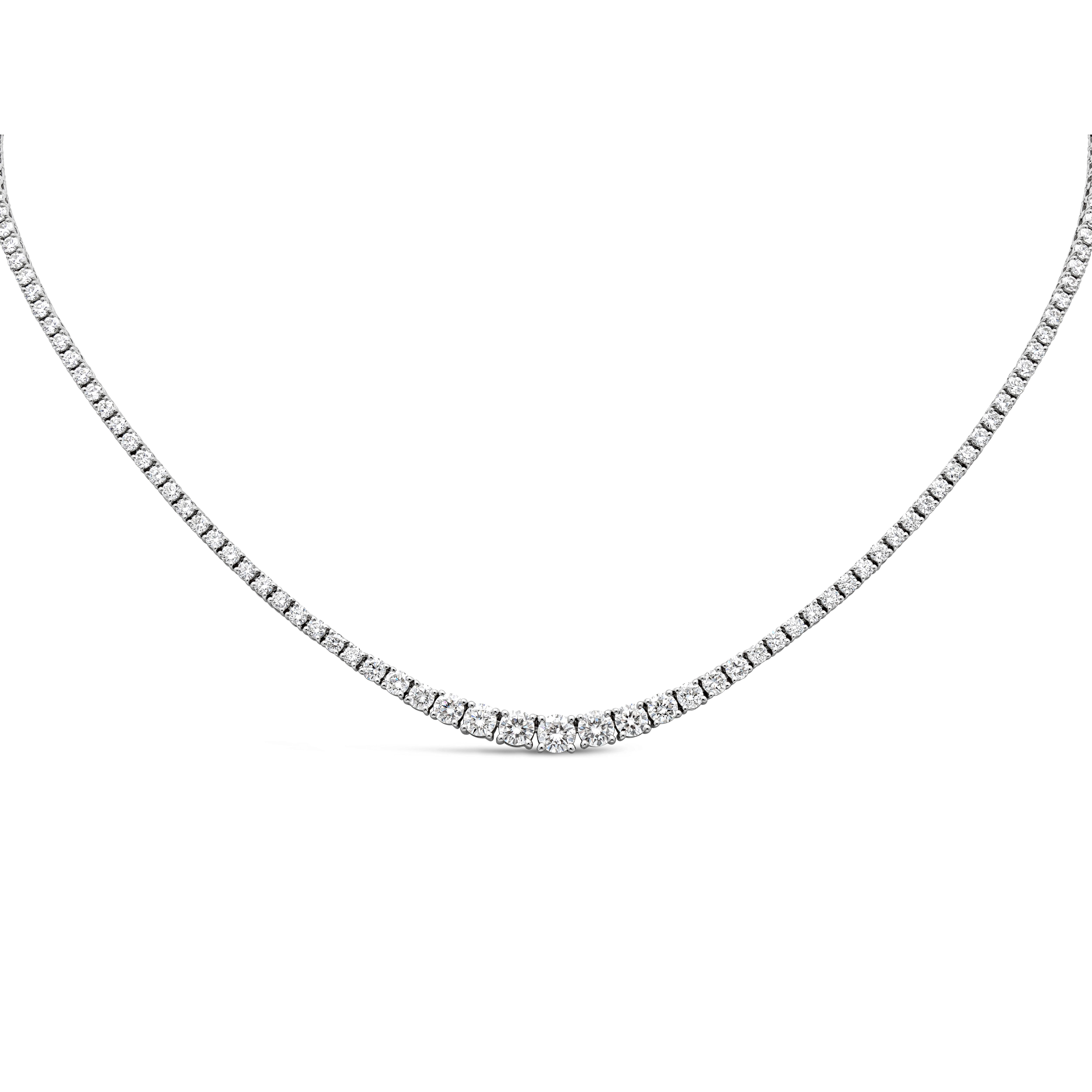 A brilliant and classic piece of jewelry showcasing a line of round brilliant diamonds that elegantly get larger to the center of the necklace. Brilliant round diamond weigh 5.16 carats, largest diamond at the center weighs 1.09 carats GH Color and