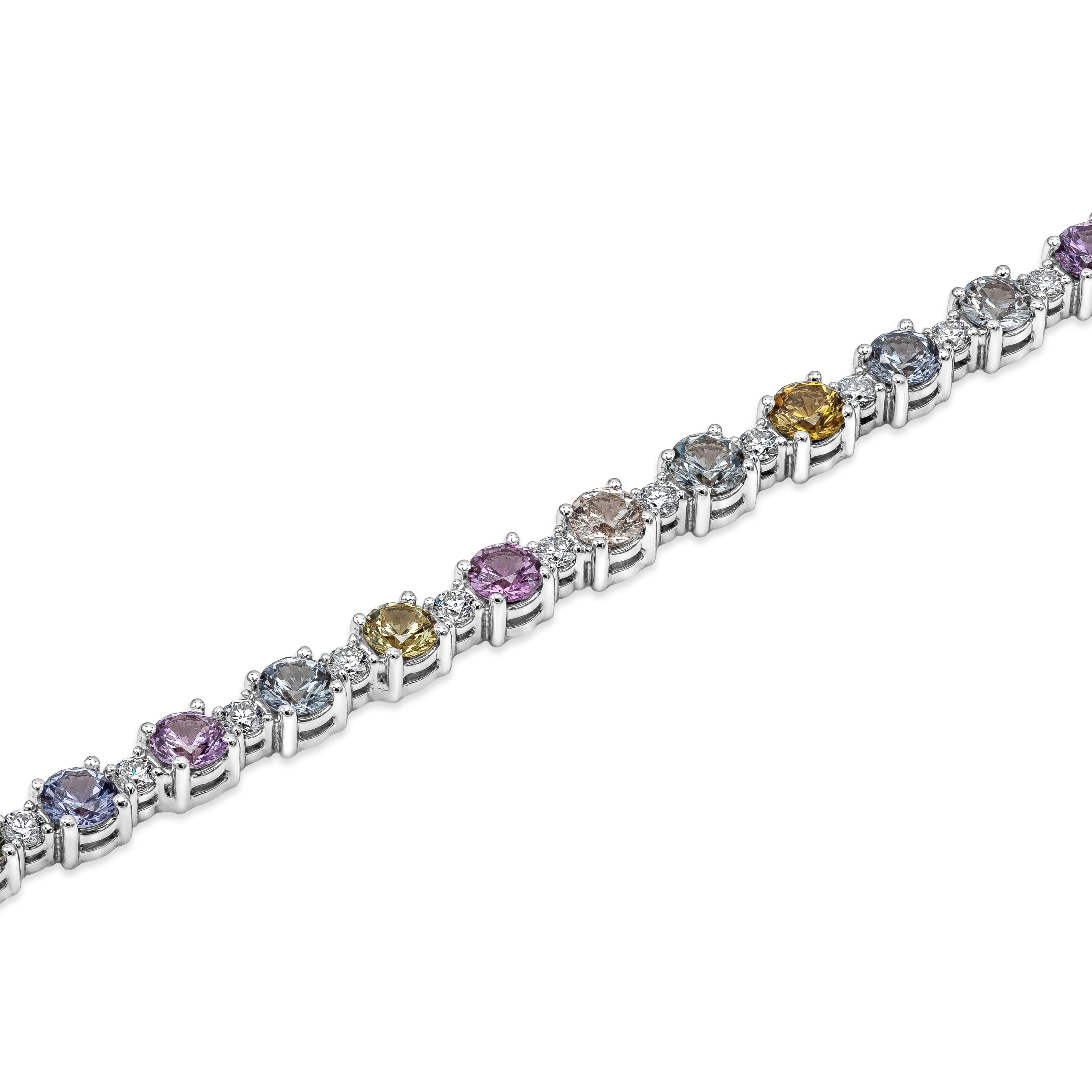 This unique and stylish tennis bracelet showcases a row of round shape multi-color sapphires, evenly spaced by round brilliant diamonds. Sapphires weigh 6.35 carats total, VVS in Clarity. Diamonds weigh 1.00 carats total, G Color and VS in Clarity.