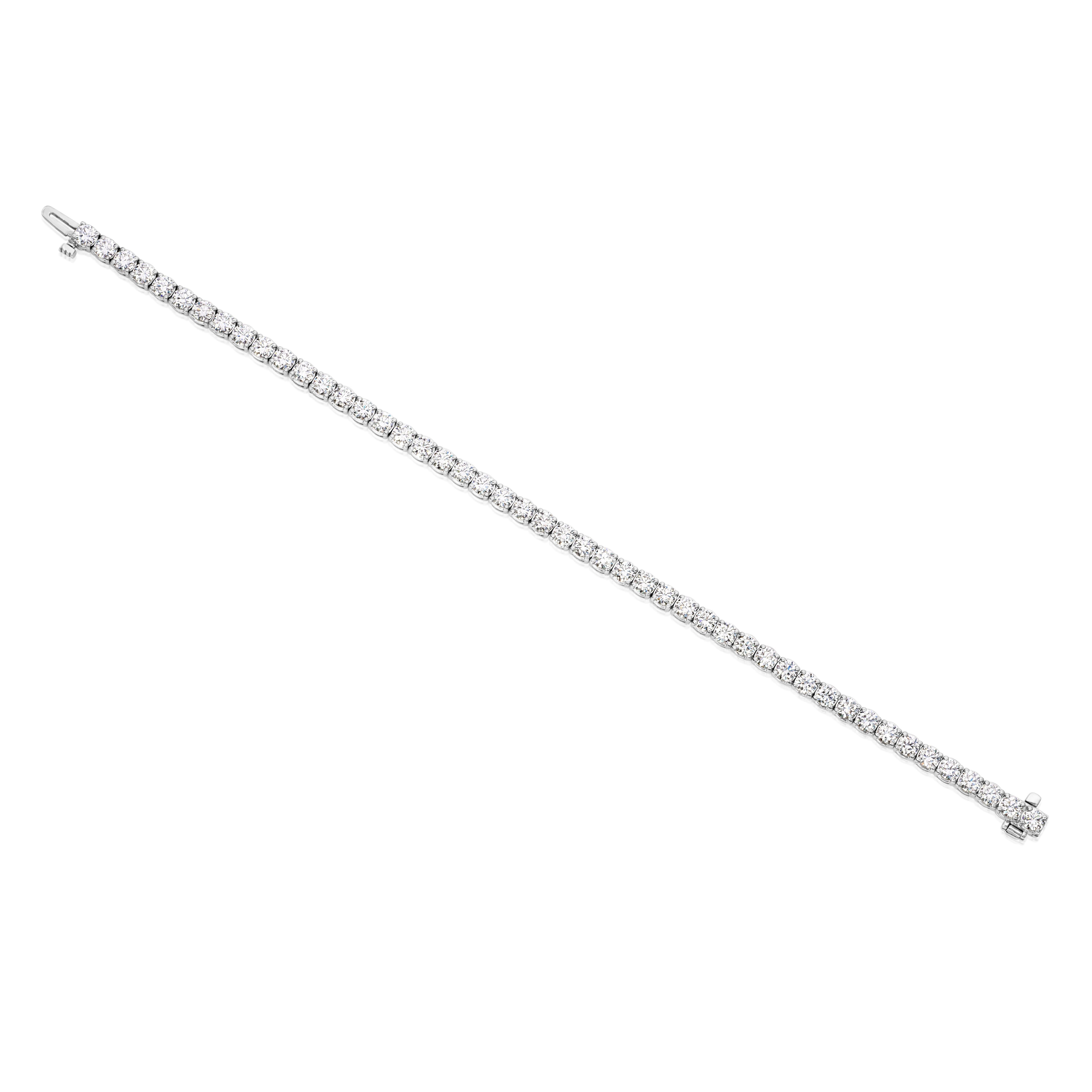 A classic tennis bracelet, showcasing 48 round brilliant cut diamonds weighing 6.51 carats total with G color and VS clarity, each set on a four prong setting. Finely made with 14K white gold, 7 inches in length. Perfect for casual or formal wear.