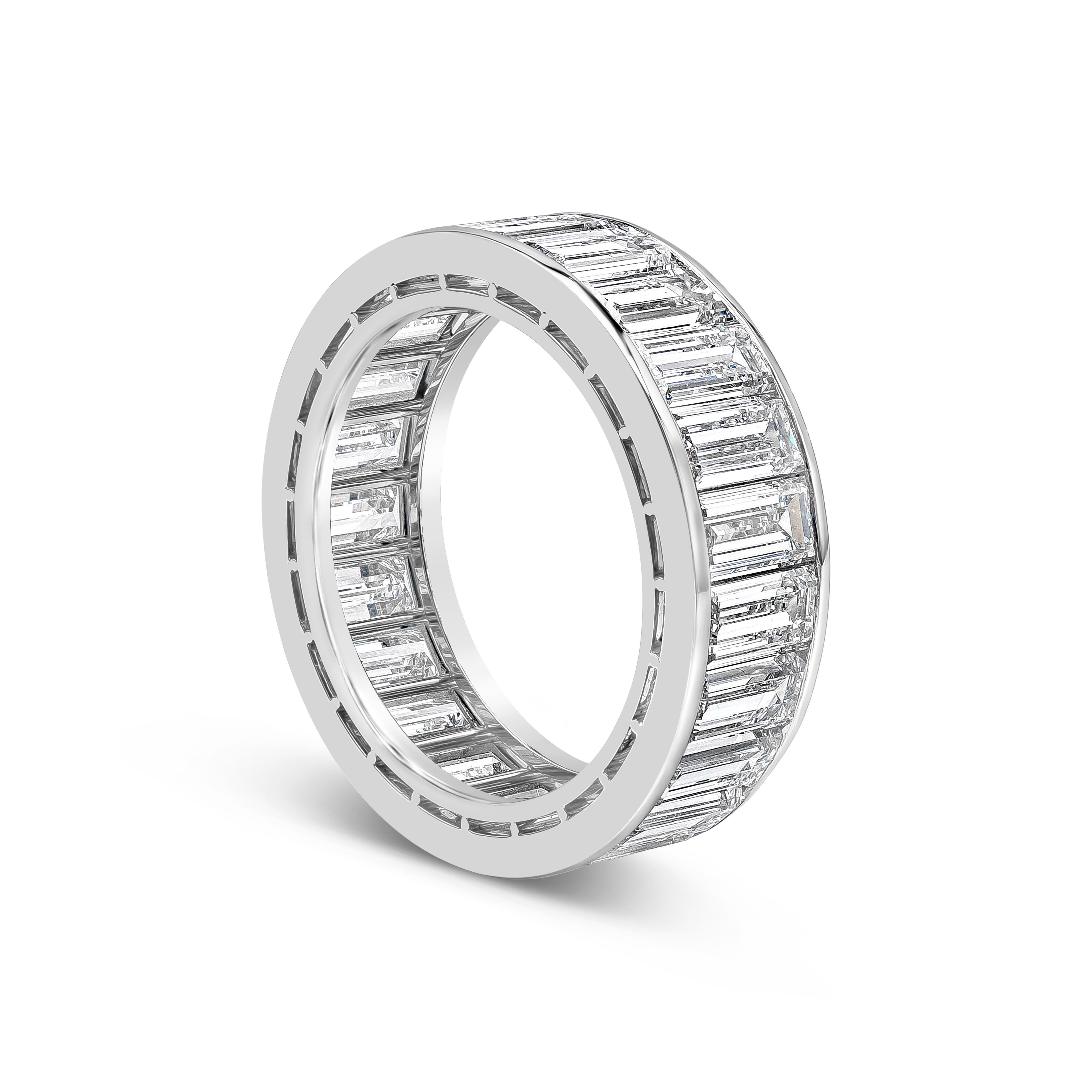 A beautiful and sleek eternity wedding band ring showcasing a row of  perfectly matched colorless baguette cut diamonds weighing 6.97 carats total, D-E-F Color and VS in Clarity. Finely made in Platinum, Size 6.5 US resizable upon request and 6.45mm