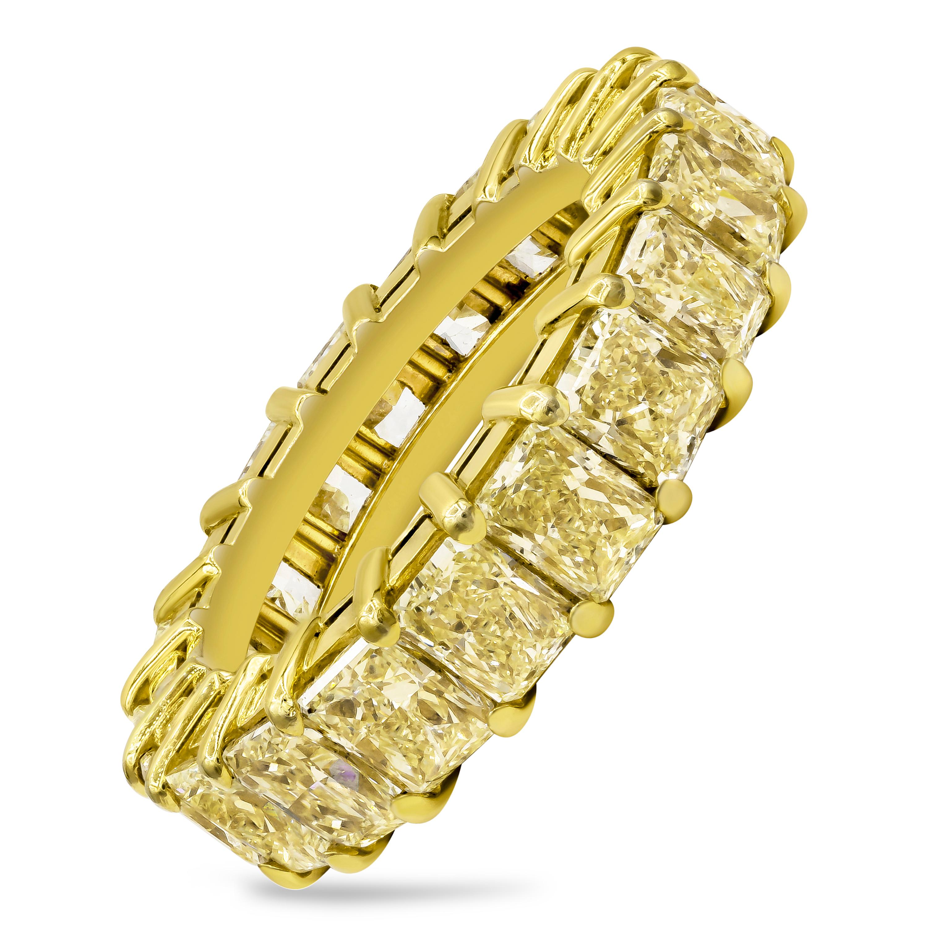 Showcasing a timeless eternity wedding band ring with natural fancy yellow diamonds weighing 7.06 carats total. Set in a classic open gallery shared prong setting made in  18K Yellow Gold, Size 6 US resizable upon request and 4.1 mm in width.