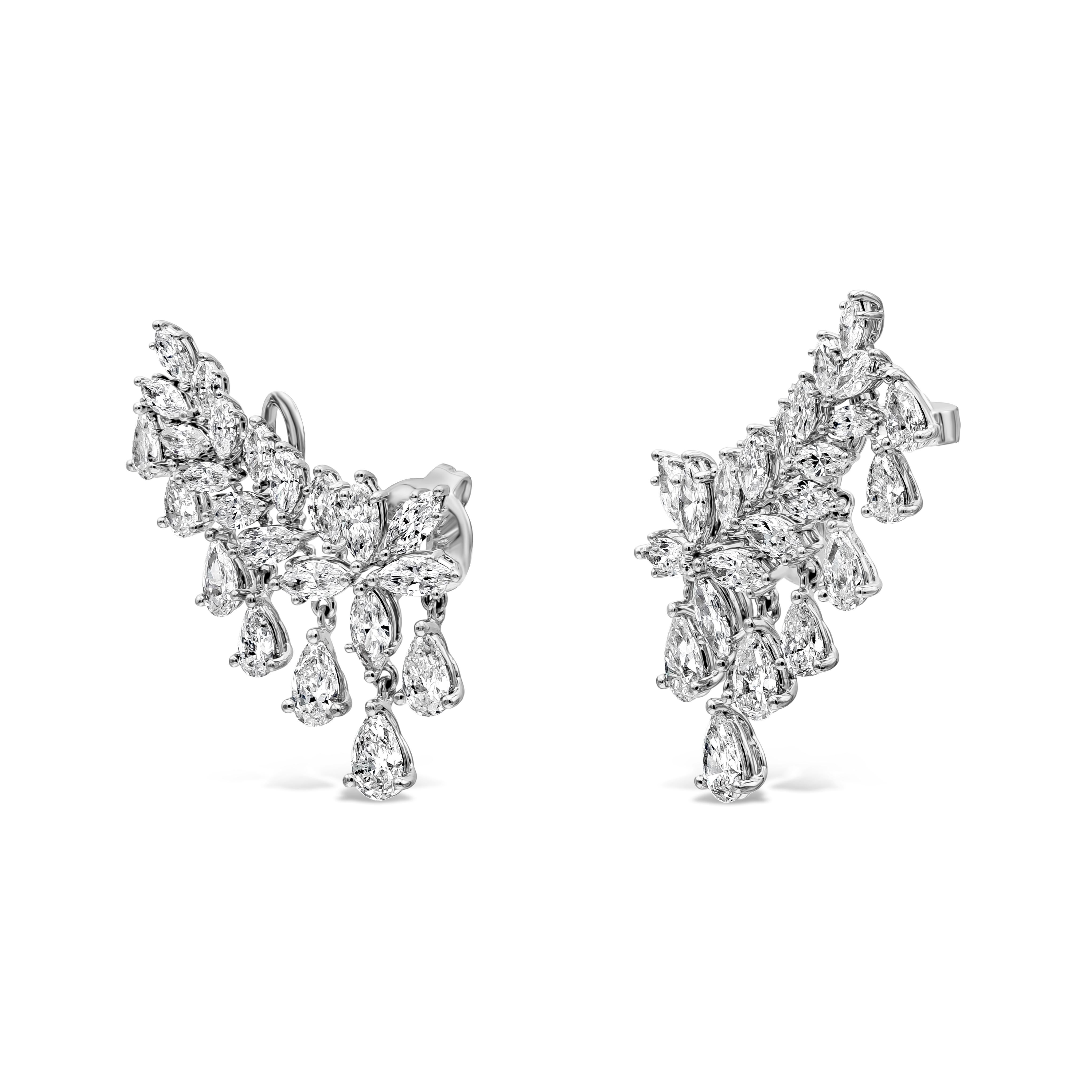 A very stylish and elegant crawler earrings showcasing pear and marquise cut diamonds that weighs 13.76 grams. Diamonds weighs 7.21 carats total. The pair is 22mm in length and 30mm in width. Made with 18K White Gold

Style available in different