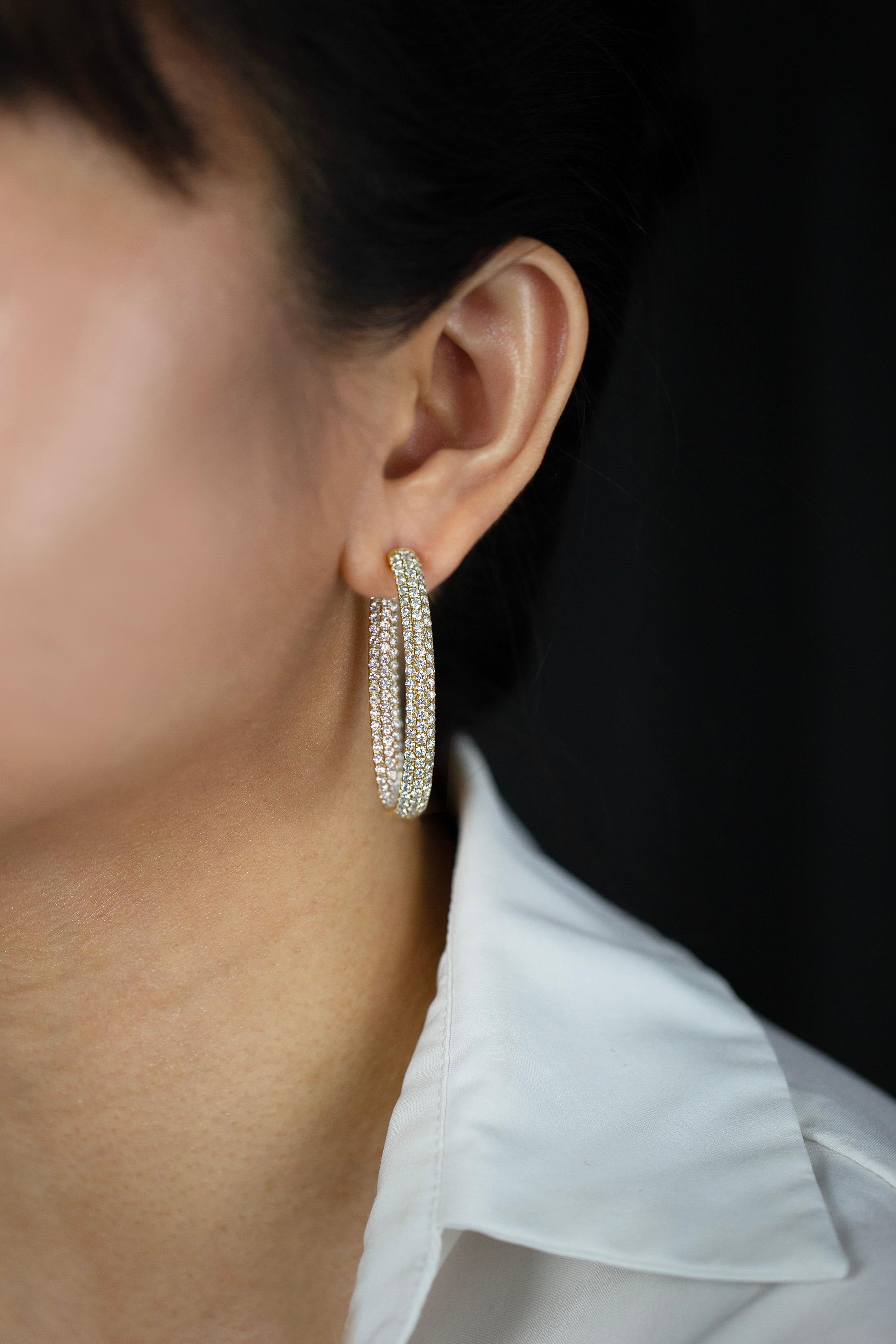 A classic hoop earrings showcasing a brilliant round diamonds weighing 7.35 carats total, set in a micro-pace set in the inside and the outside. Finely made in 18K Yellow Gold. 

Style available in different price ranges. Prices are based on your