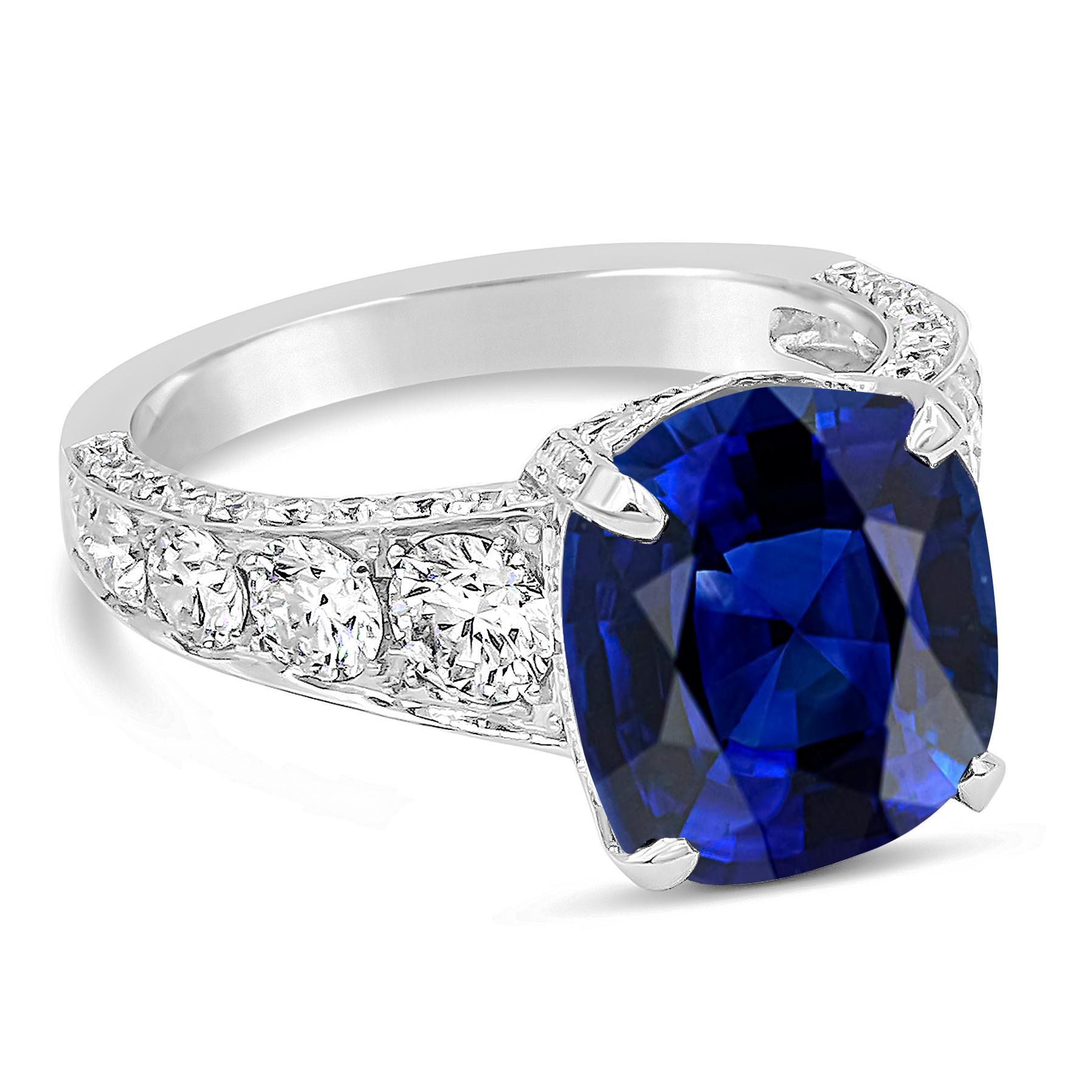 An appealing and exquisite gemstone engagement ring showcasing a GRS Certified Sri Lanka Origin vivid blue sapphire center stone weighing 7.66 carats total, Royal Blue in Color. Accented by graduating brilliant round diamonds set on the crown and