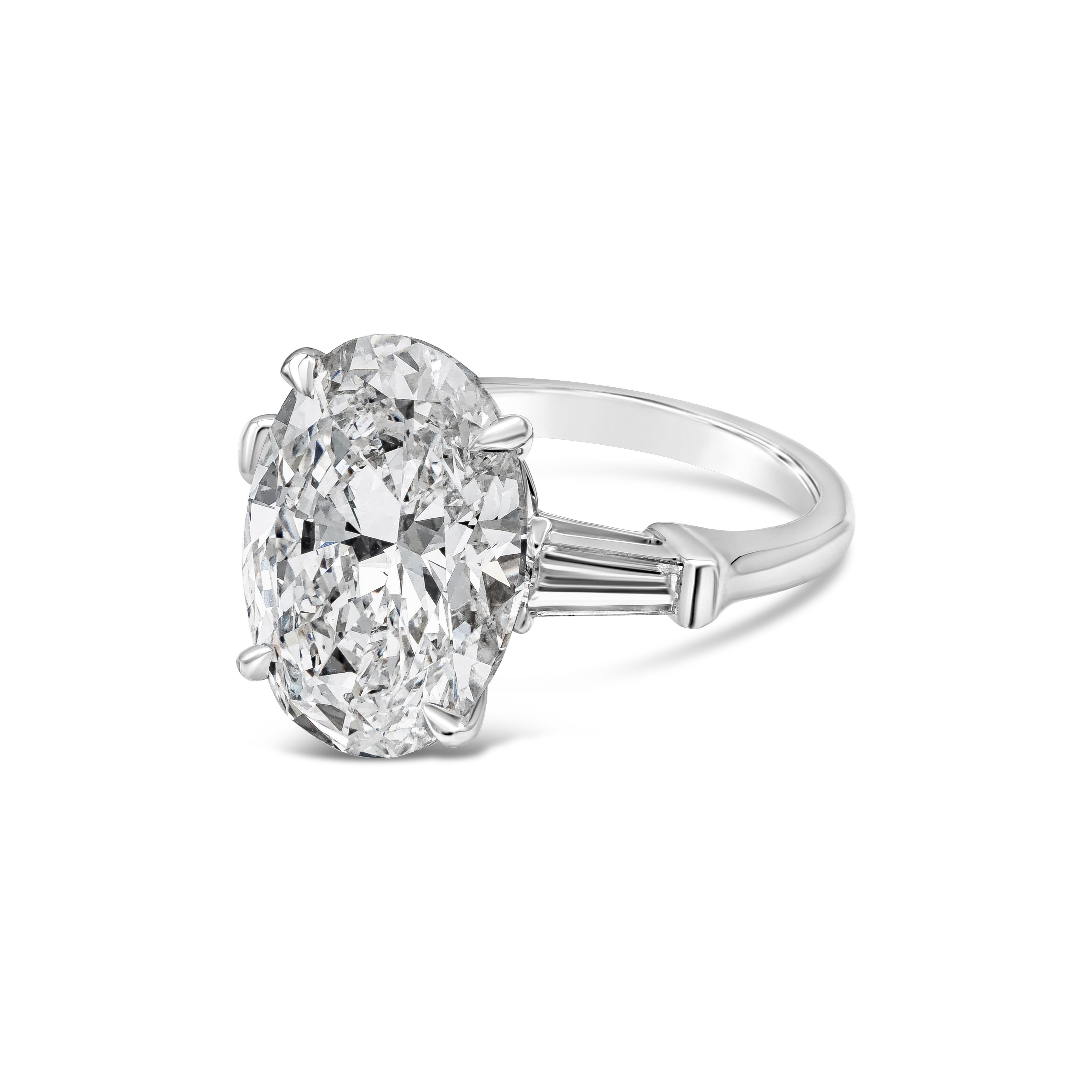 Showcasing a rare 8.05 carat oval cut diamond certified by GIA as D color, SI1 clarity. Flanking the center are baguette diamonds on both side with D color and VS clarity. Set in an everlasting platinum mounting. Accent diamonds weigh 0.50 carats