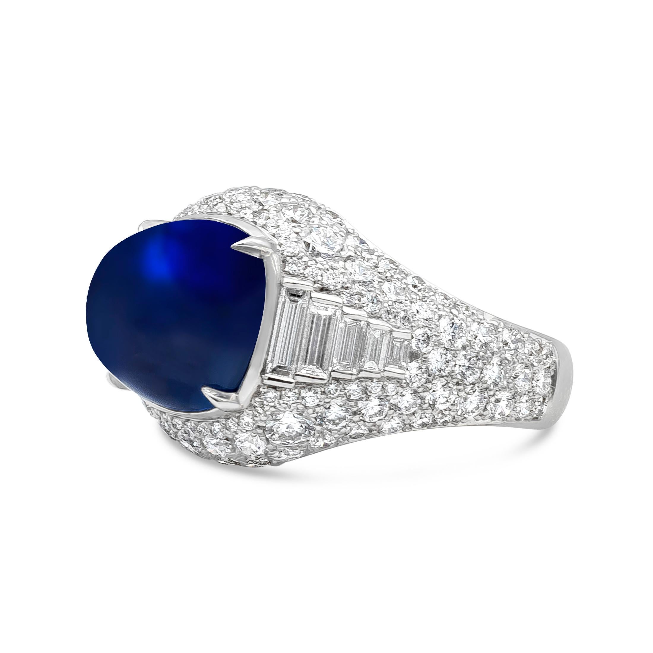 A stylish and high end cocktail ring, showcasing  8.42 carats of elongated blue cabochon surrounded by 10 baguette diamonds of 0.65 carat total and 69 round diamonds of 2.03 carats total. All white diamonds have D-E-F color and VS clarity. Set on