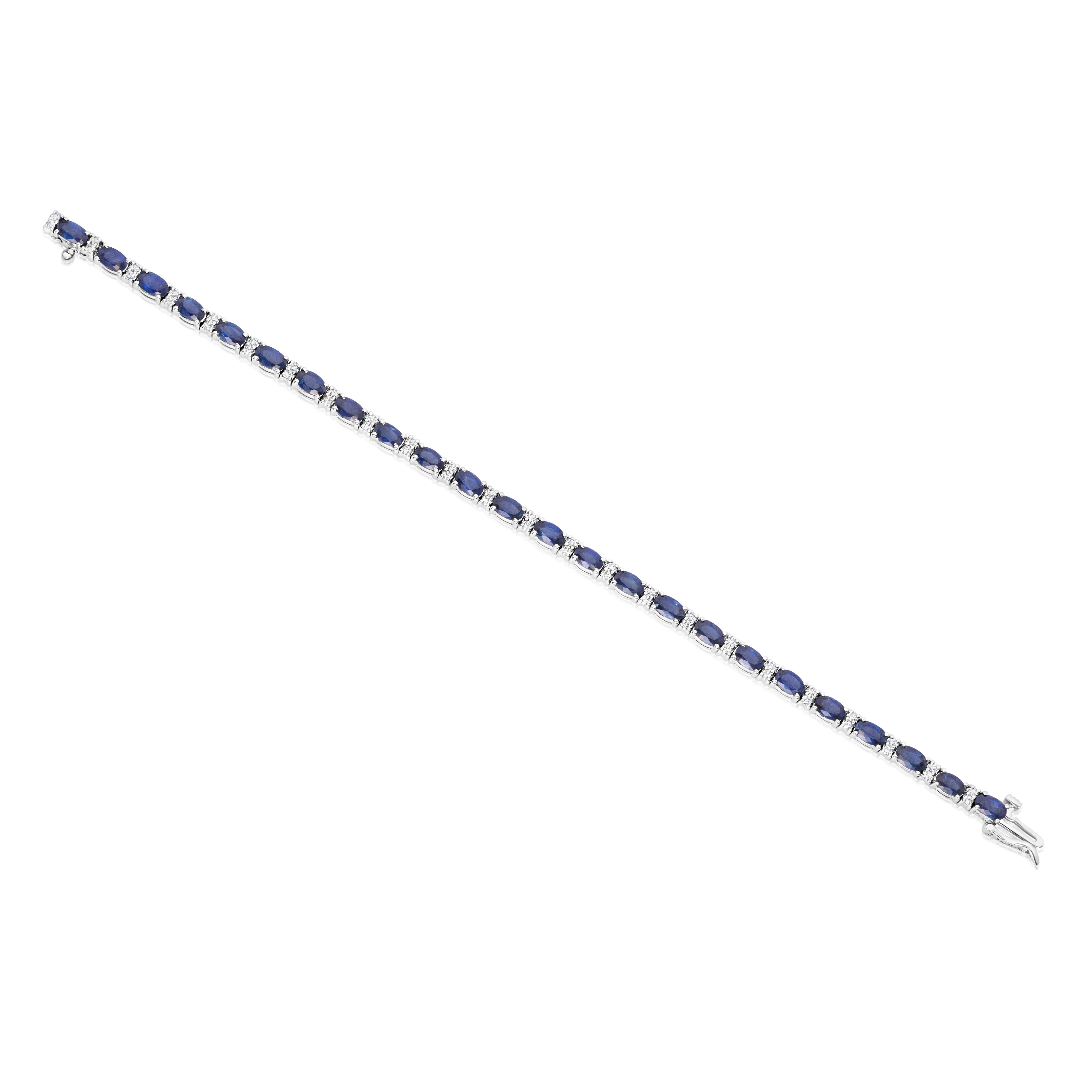 A charming tennis bracelet, featuring an alternating style of 24 oval cut sapphires weighing 8.51 carats total and 48 round cut diamonds weighing 0.63 carat total. Finely set on 14K white gold, 6.75 inches in length. Perfect for casual or formal