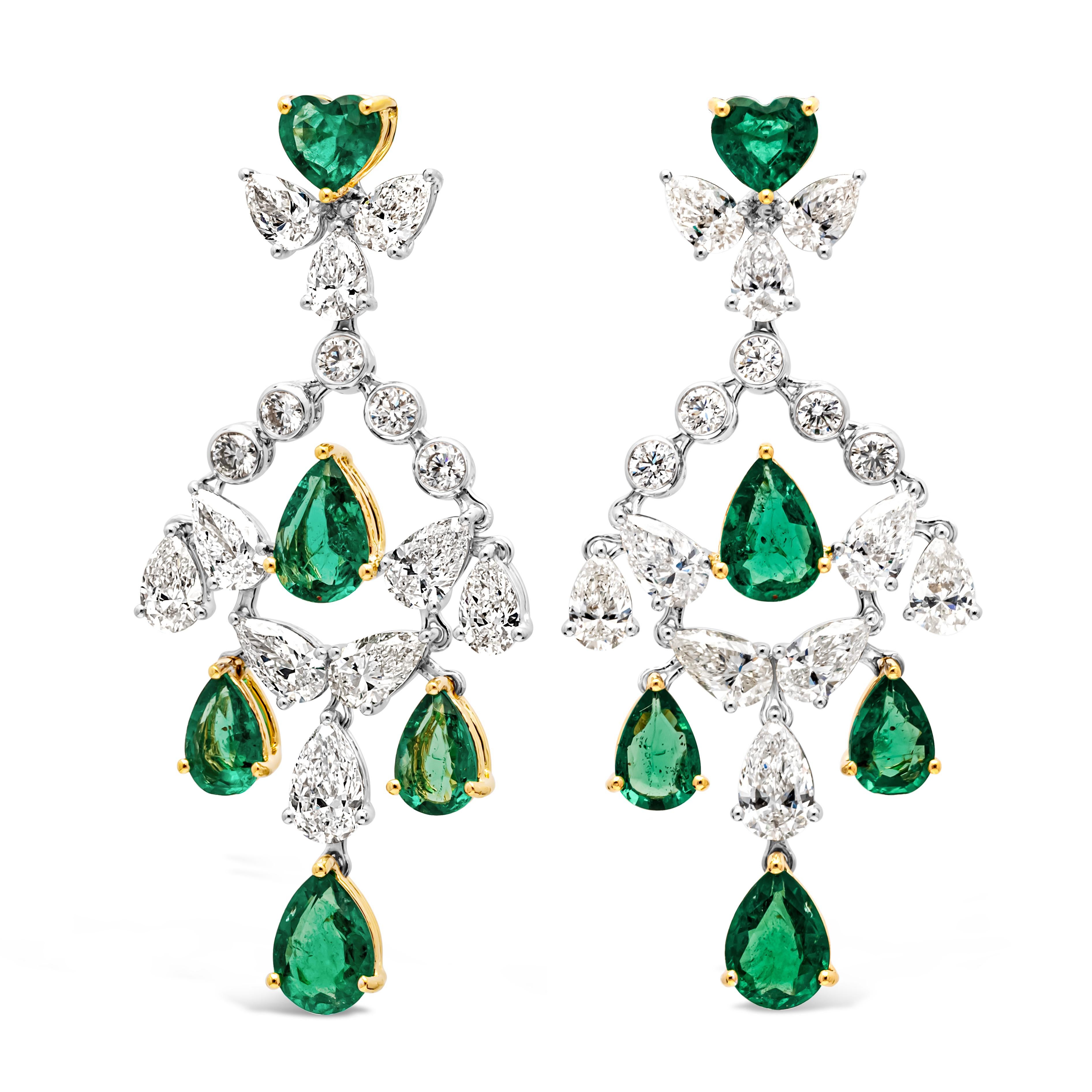 Showcasing a stunning and fashionable pair of chandelier earrings set with mixed cut color-rich green emerald and diamonds in a beautiful chandelier 'shoulder duster' design. Green emeralds weigh 4.23 carats total and diamonds weigh 4.33 carats