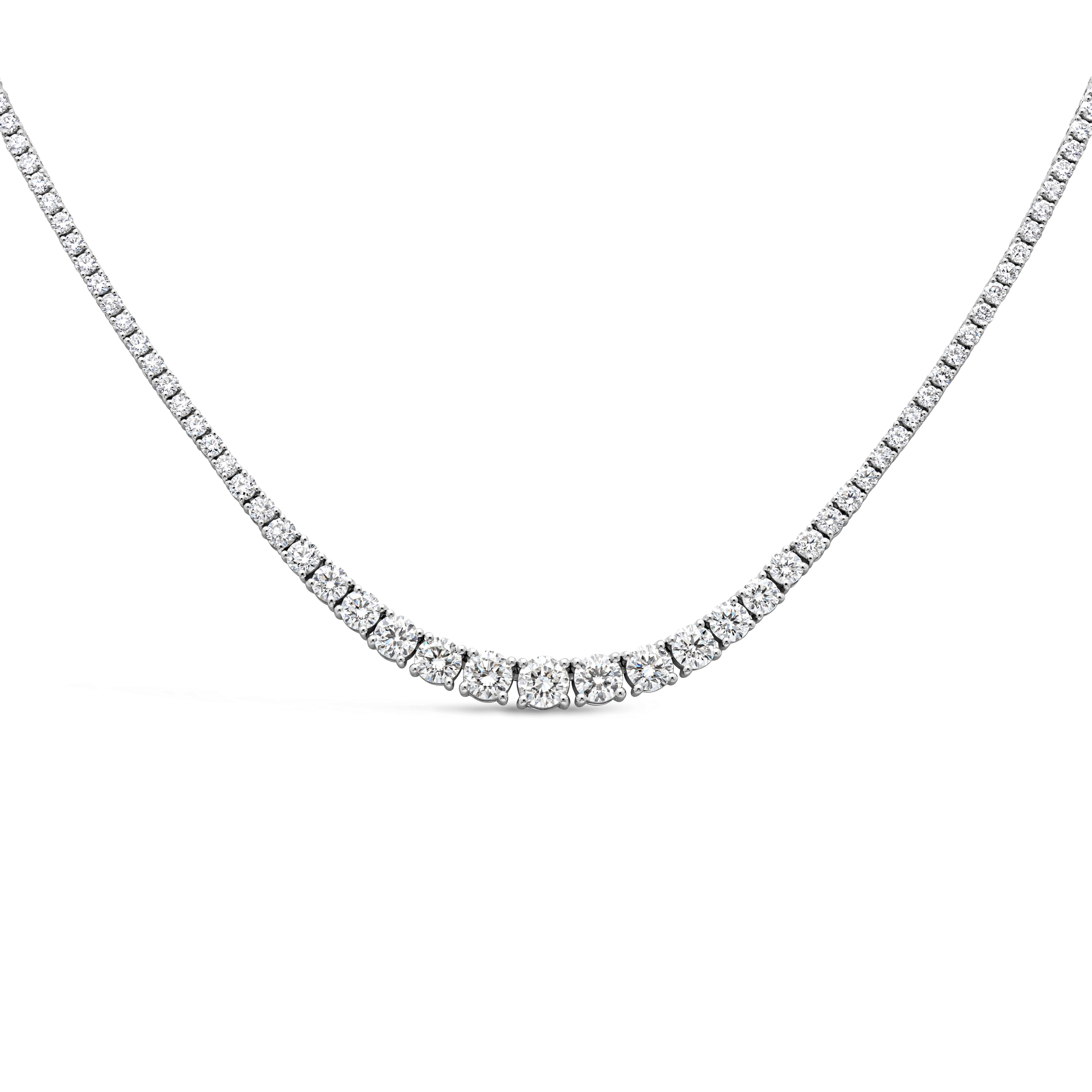 A brilliant and classic piece of jewelry showcasing a line of round brilliant diamonds that elegantly get larger to the center of the necklace. Diamonds weigh 5.72 carats, largest diamond at the center weighs 2.90 carats GH Color and VS in Clarity.