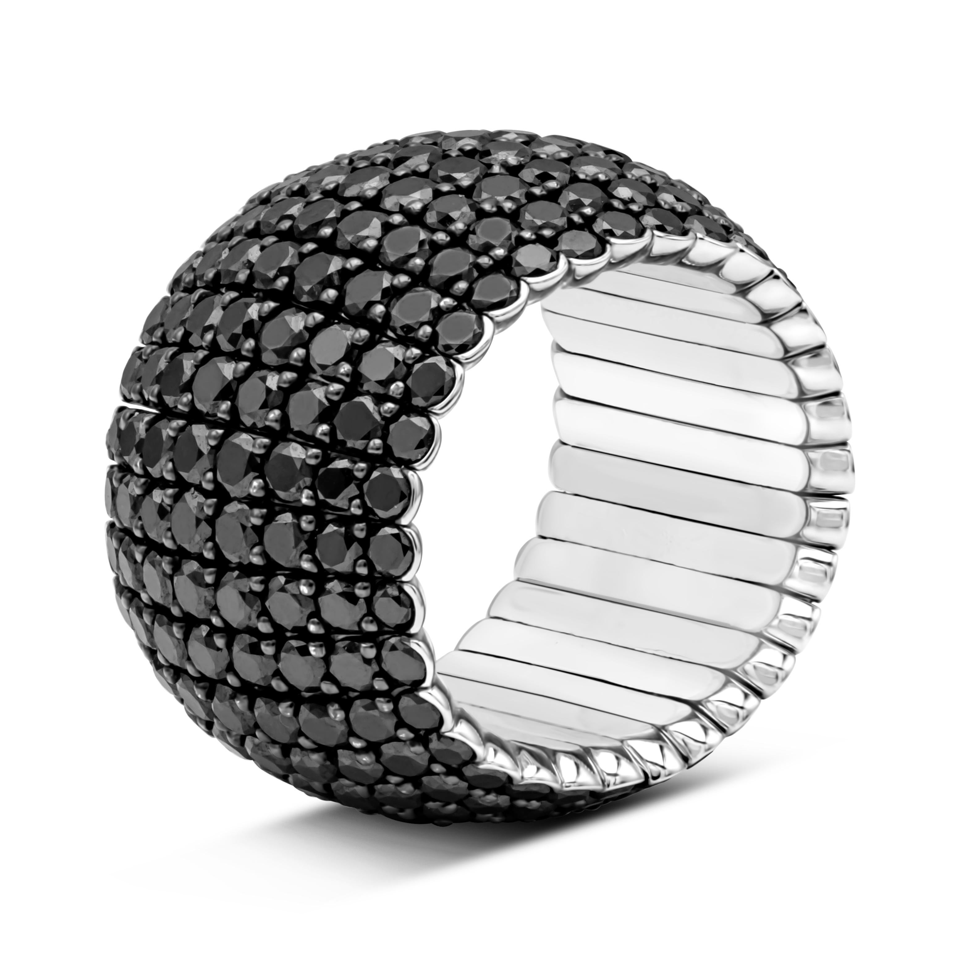 This stylish and stunning flexible fashion ring showcases eight rows of 256 brilliant round cut black diamonds weighing 9.09 carats total, set in a beautiful micro-pave set and shared prong setting. Finely made in 18k white gold. Size 7 US resizable