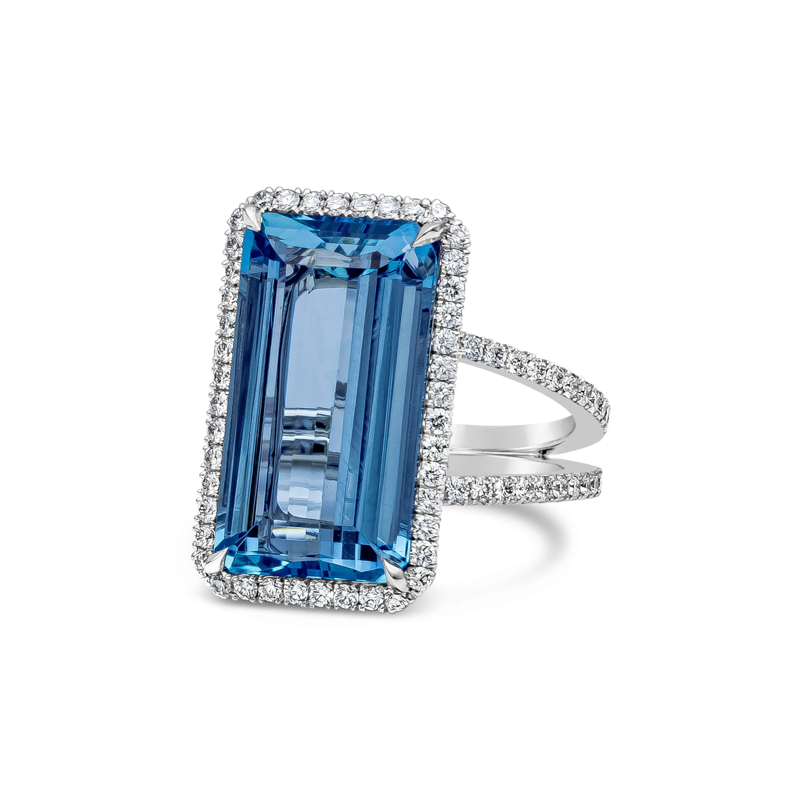 A gorgeous gemstone fashion ring featuring 9.17 carat emerald cut aquamarine gemstone, surrounded by 138 round brilliant diamonds that weigh 0.96 carats in total, F-G color and VS in clarity. This ring is set in a split shank diamond encrusted band