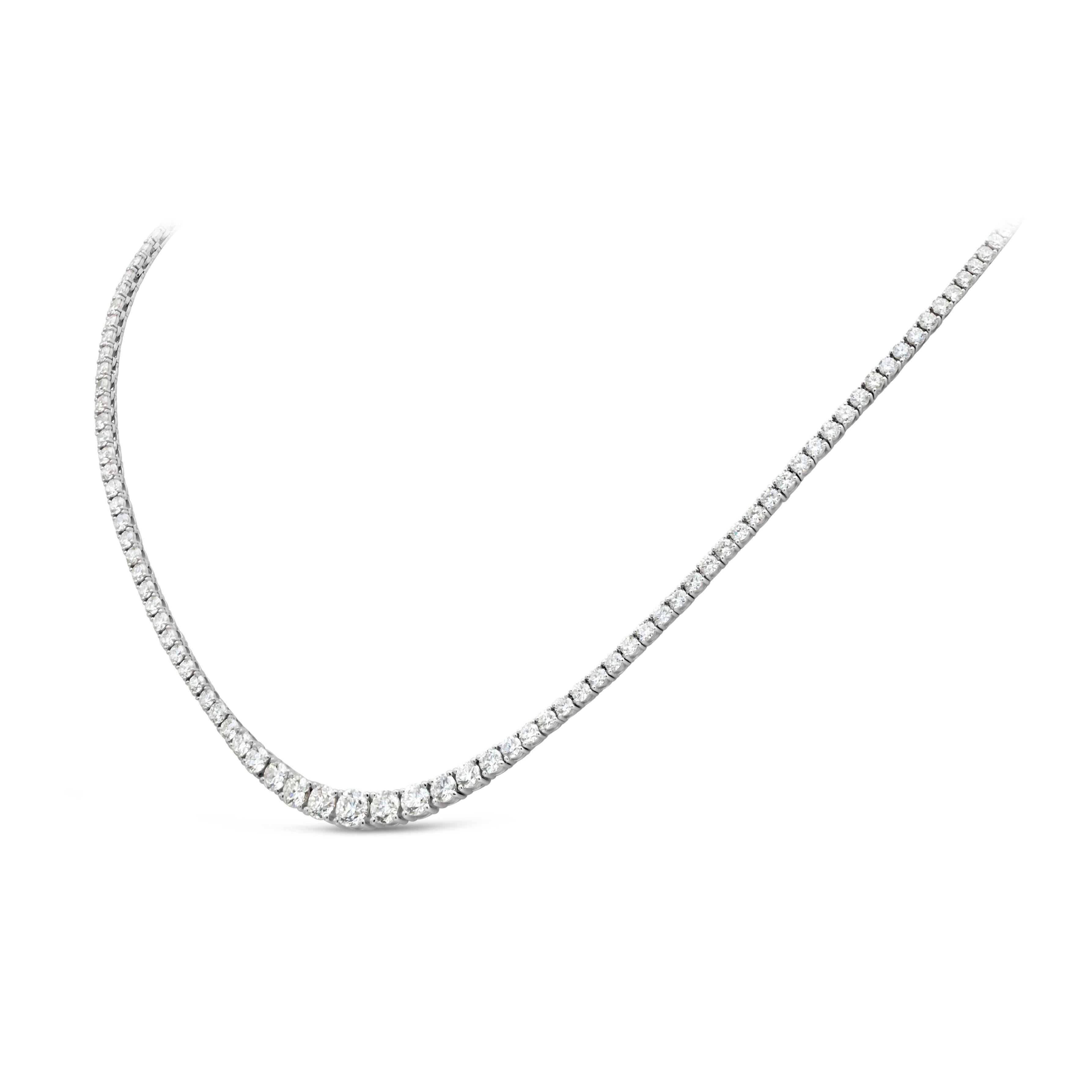 This fine dazzling slight graduation fashion tennis necklace features 9.25 carats total round brilliant diamonds, G Color and VS2-SI1 in Clarity. Set in a classic four-prong setting, finely crafted 18K White Gold. 

16 inch length, can also be