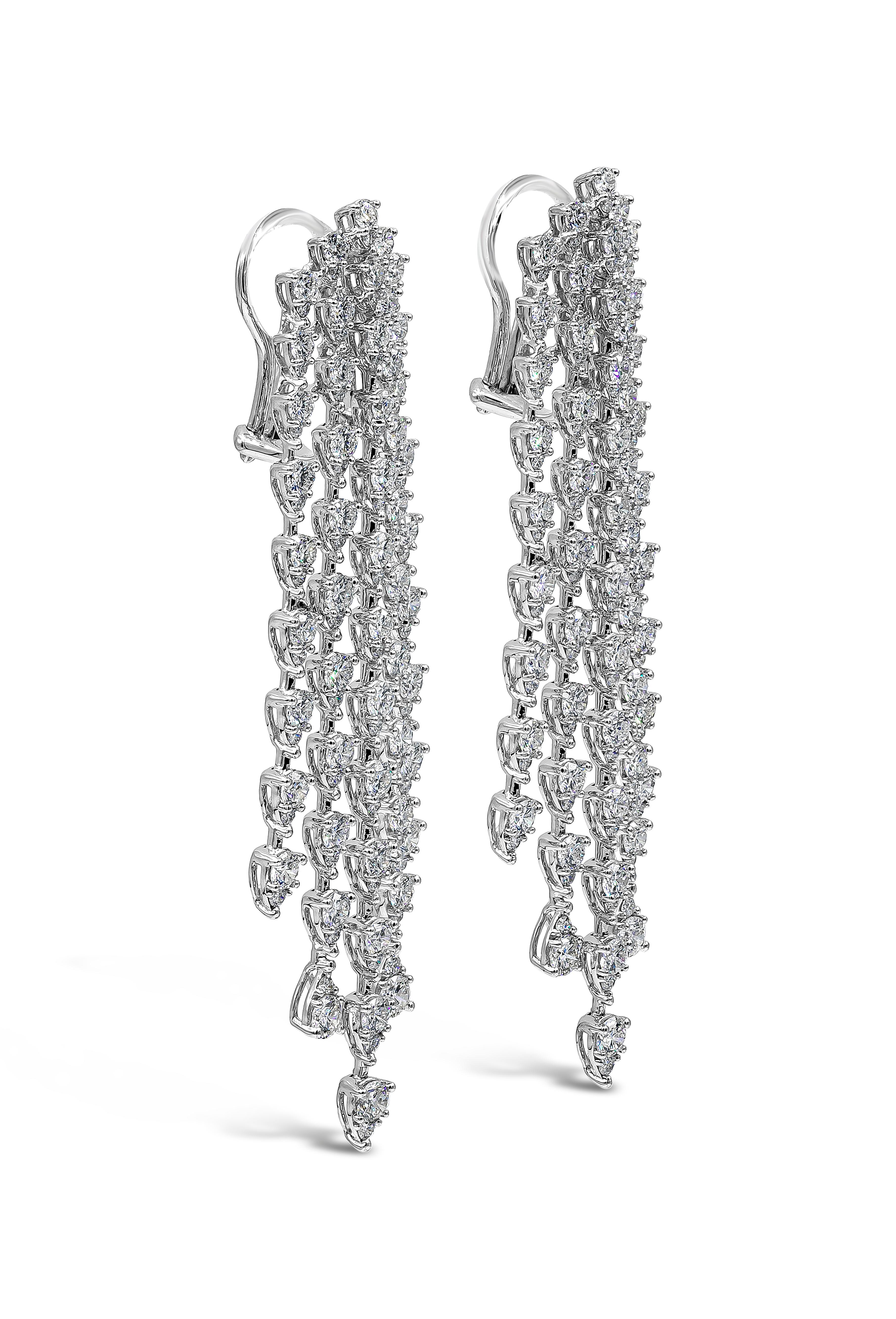 This versatile and stylish chandelier earrings showcasing five-rows of round brilliant pear shape illusion diamonds set in an elegant chandelier waterfall design and made in 18k white gold. Diamonds weigh 9.35 carats total and are approximately F-G