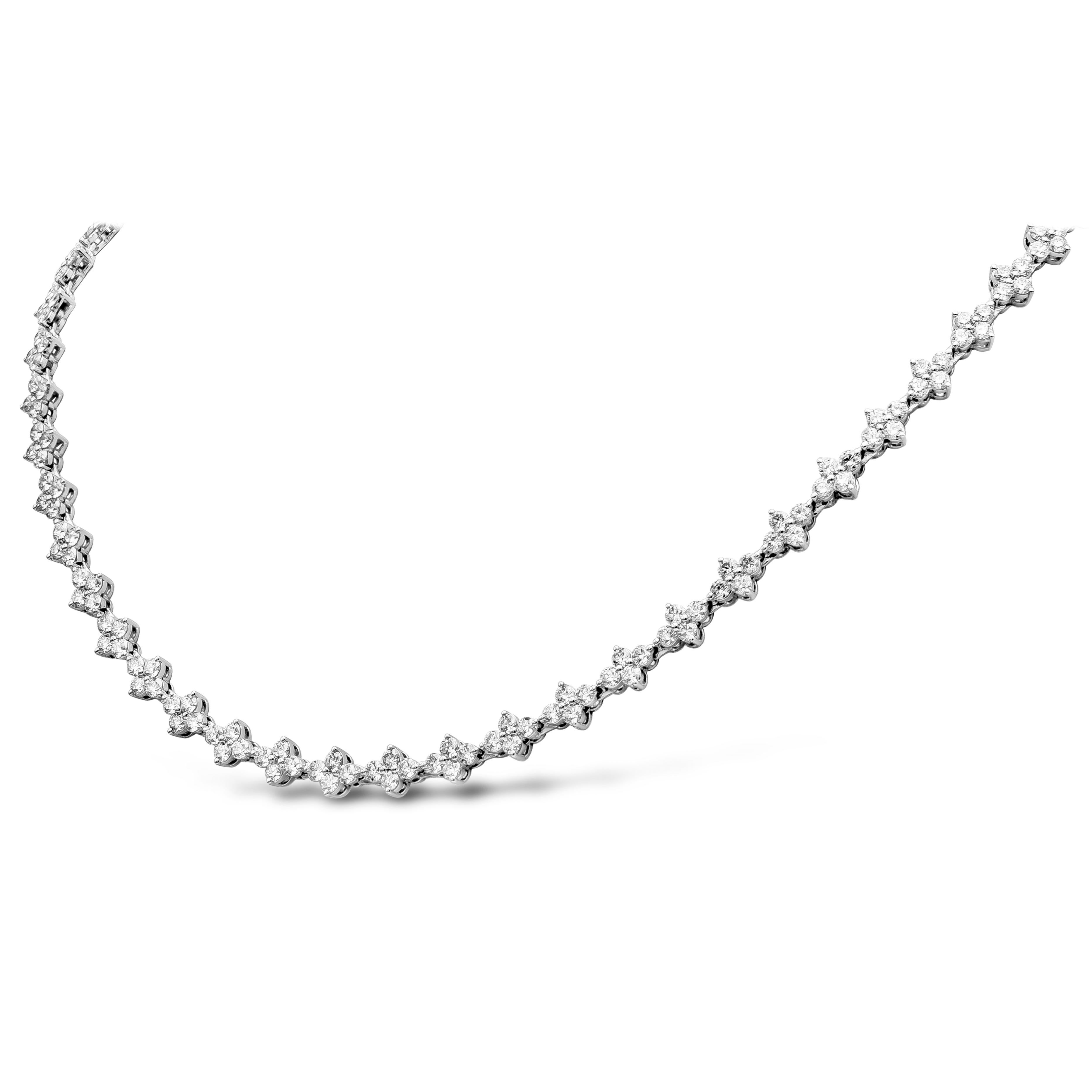 A magnificent tennis necklace showcasing round brilliant diamonds clustered in groups of 4. Necklace has 216 stone weighing 9.59 carats, F+ Color and VS-SI in Clarity. 16 inches in length and made in 18k White Gold.

Style available in different