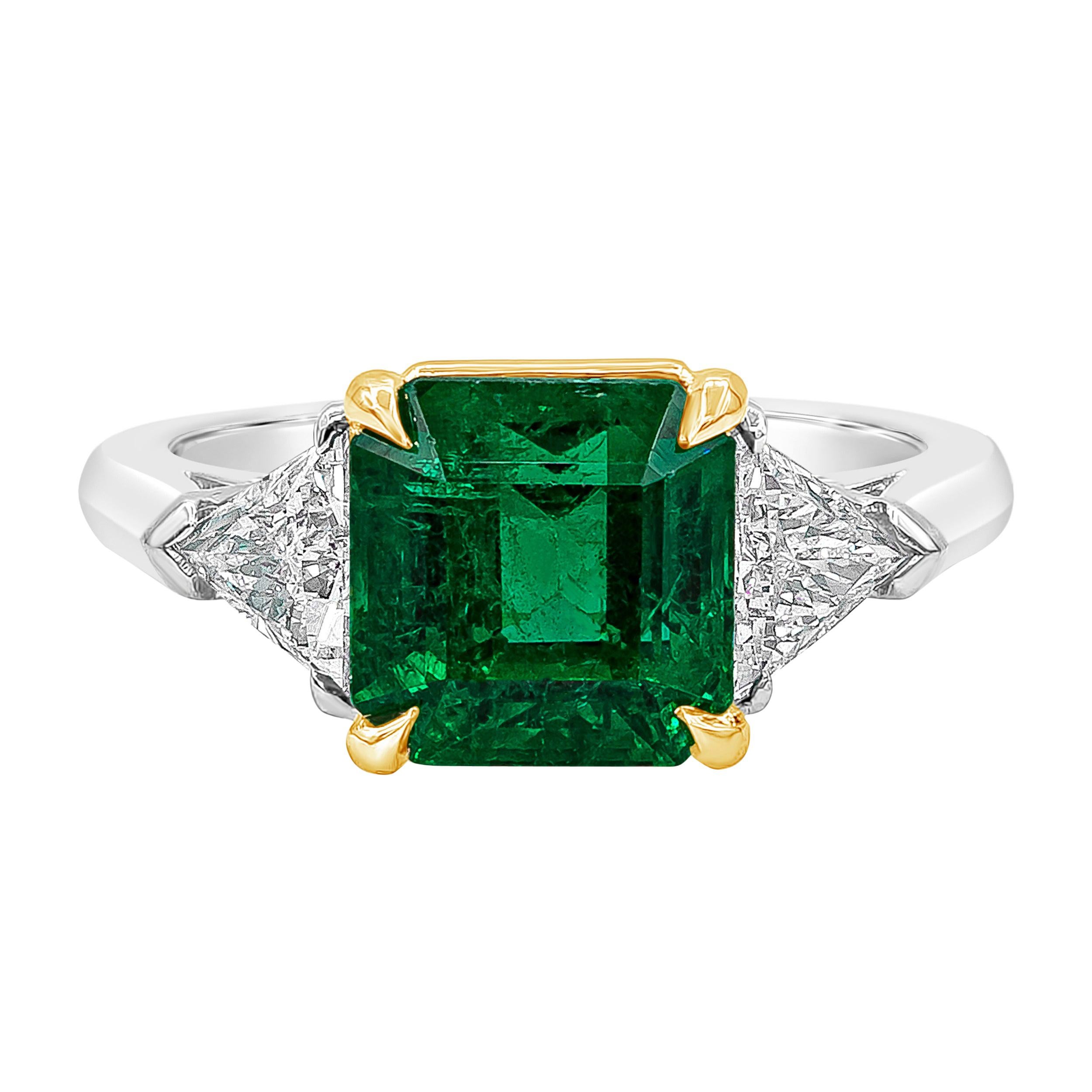 3.16 Carats Emerald Cut Green Emerald and Diamond Three-Stone Engagement Ring For Sale
