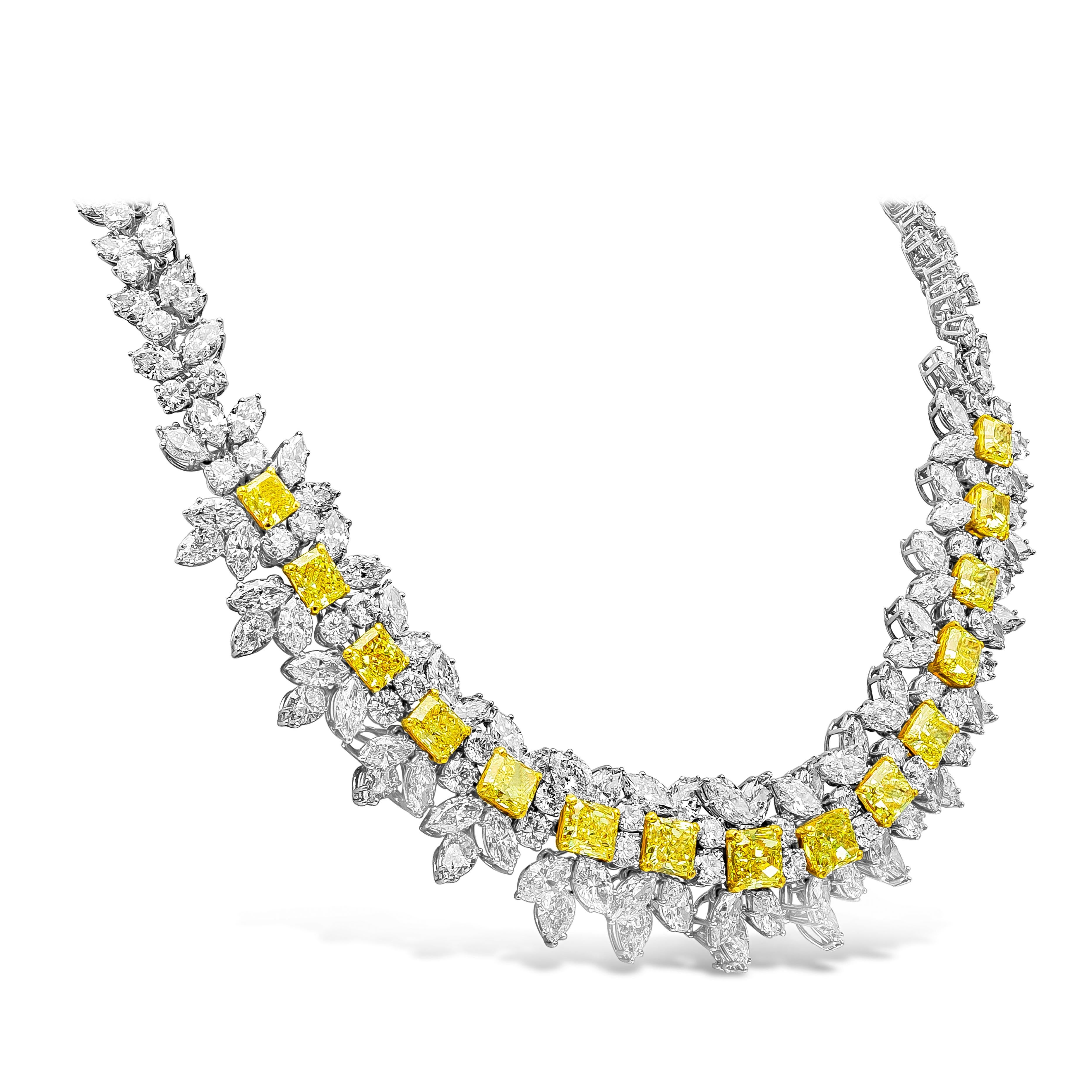 An important and very rare diamond necklace showcasing a row of graduating radiant cut fancy intense yellow diamonds, surrounded by brilliant white diamonds in an intricate and creative design. Yellow diamonds weigh 23.45 carats total, white