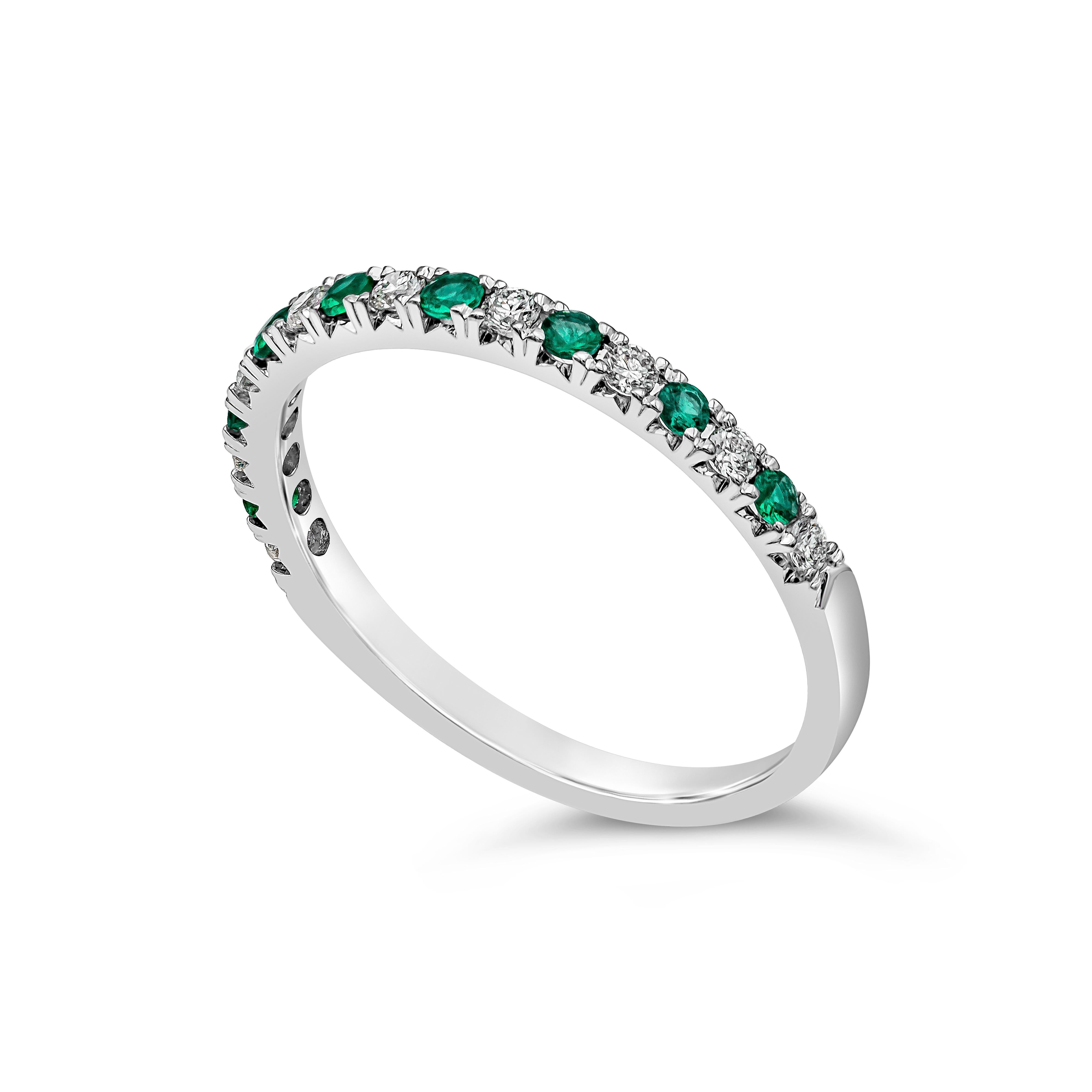 A unique wedding band style showcasing green emerald weighs 0.13 carats total, diamonds weigh 0.15 carats total, F-G color and VS-SI clarity. Made in 18k White Gold.

Style available in different price ranges. Prices are based on gemstone and