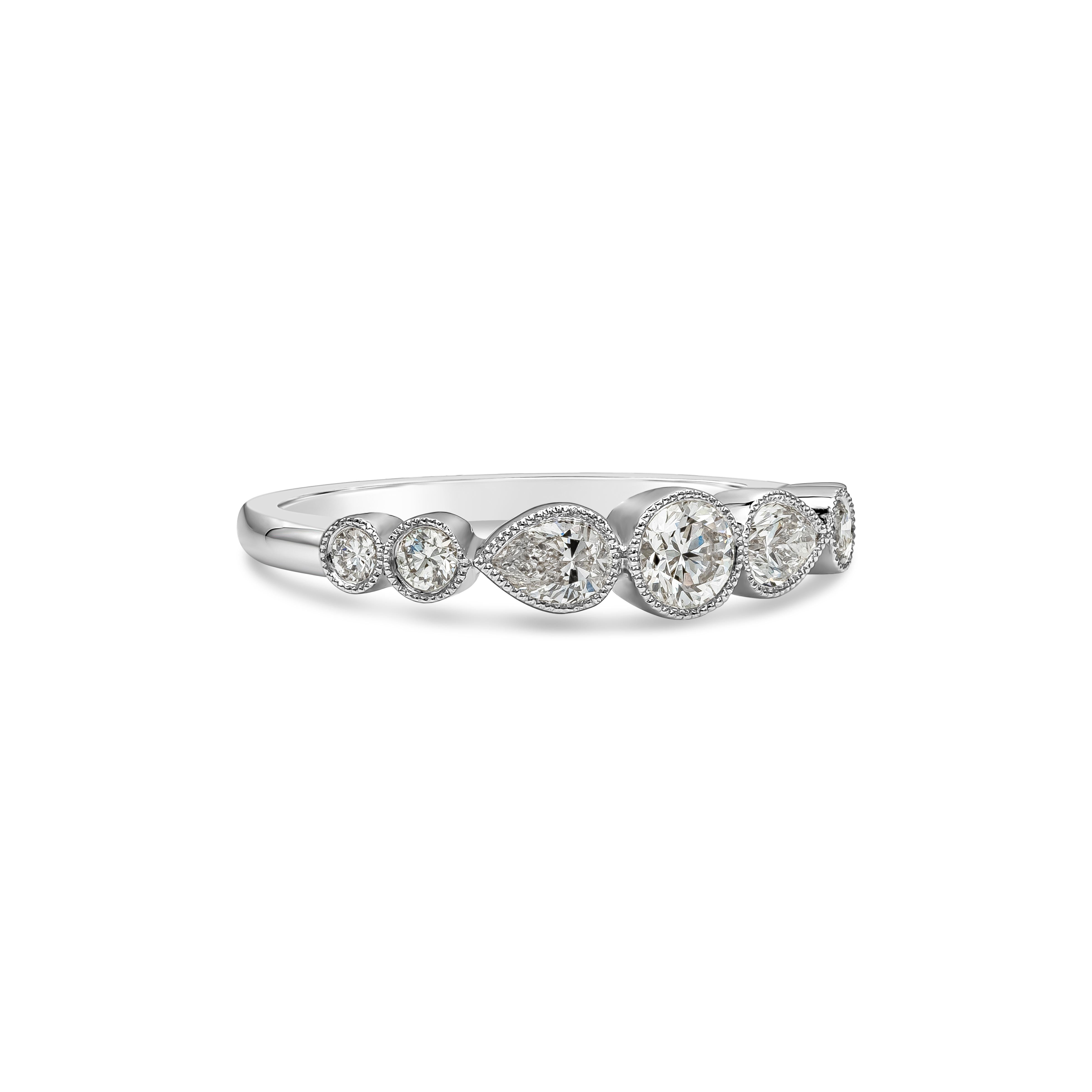 A beautiful antique-style ring showcasing round and pear shape diamonds, set in a beaded bezel, in an 18k white gold mounting. Diamonds weigh 0.62 carats total and are approximately G color, SI1 clarity.

Roman Malakov is a custom house,