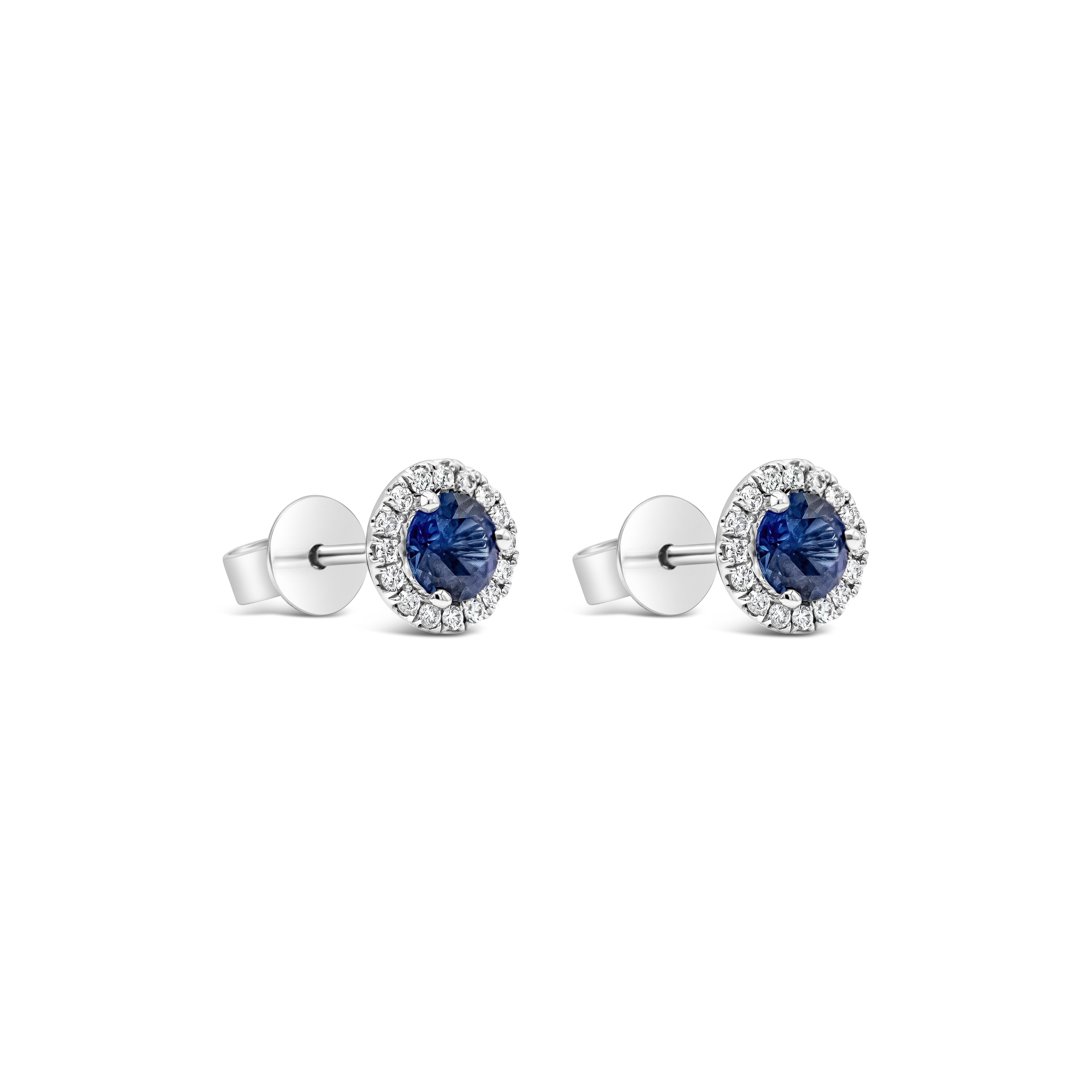 Contemporary GIA Certified 0.64 Carats Total Blue Sapphire and Diamond Halo Stud Earrings For Sale