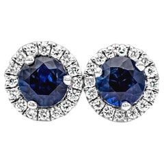 GIA Certified 0.64 Carats Total Blue Sapphire and Diamond Halo Stud Earrings