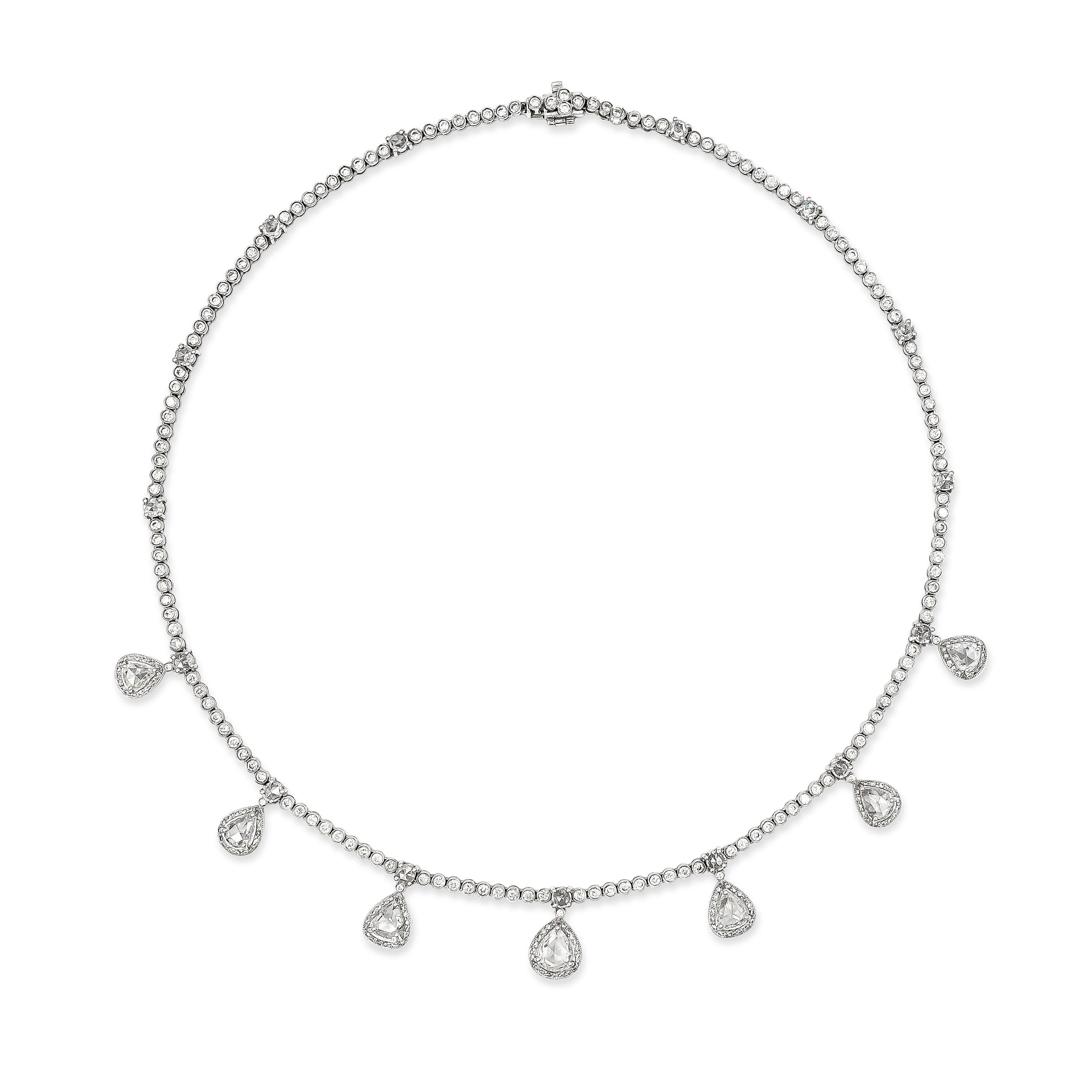 A unique and chic necklace style showcasing a row of round brilliant diamonds bezel set in 18k white gold. Accented with rose cut diamonds in pear shape and rounds, spaced evenly throughout the front of the necklace. Rose cut diamonds weigh 3.95
