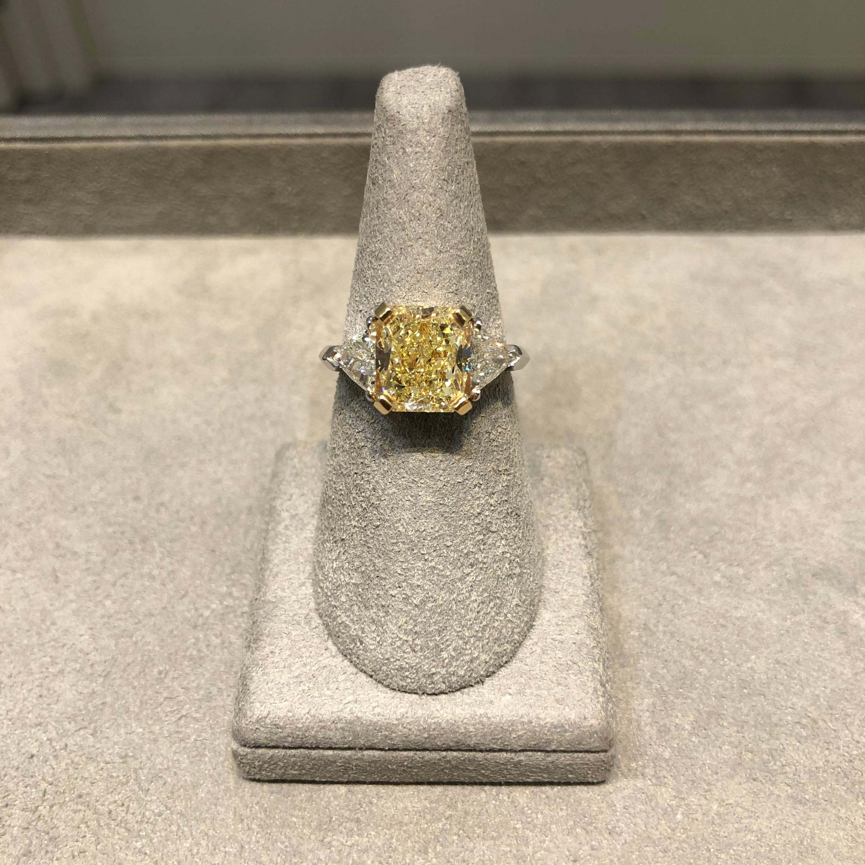 Contemporary GIA Certified 4.06 Carats Radiant Cut Yellow Diamond Three-Stone Engagement Ring For Sale