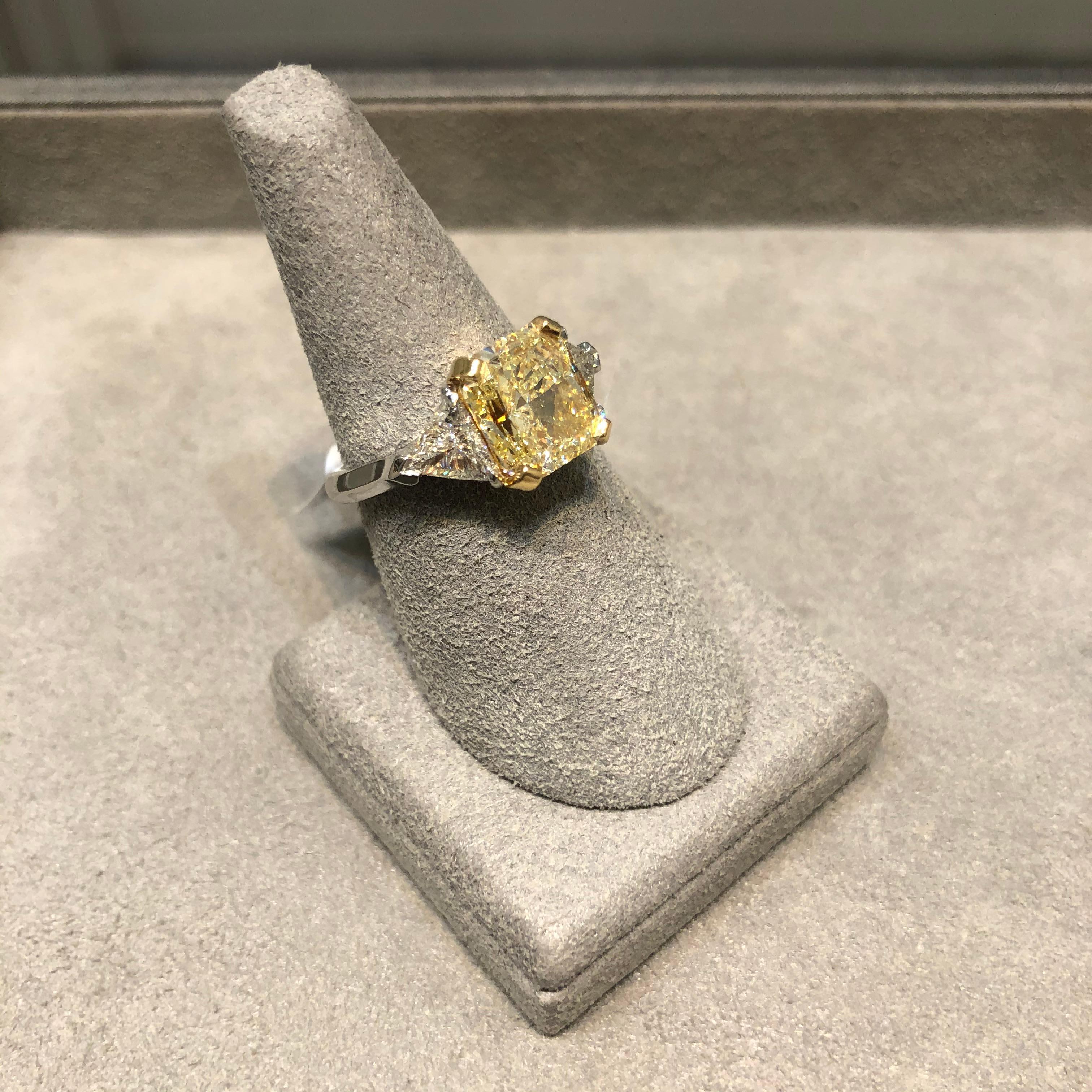 GIA Certified 4.06 Carats Radiant Cut Yellow Diamond Three-Stone Engagement Ring In New Condition For Sale In New York, NY