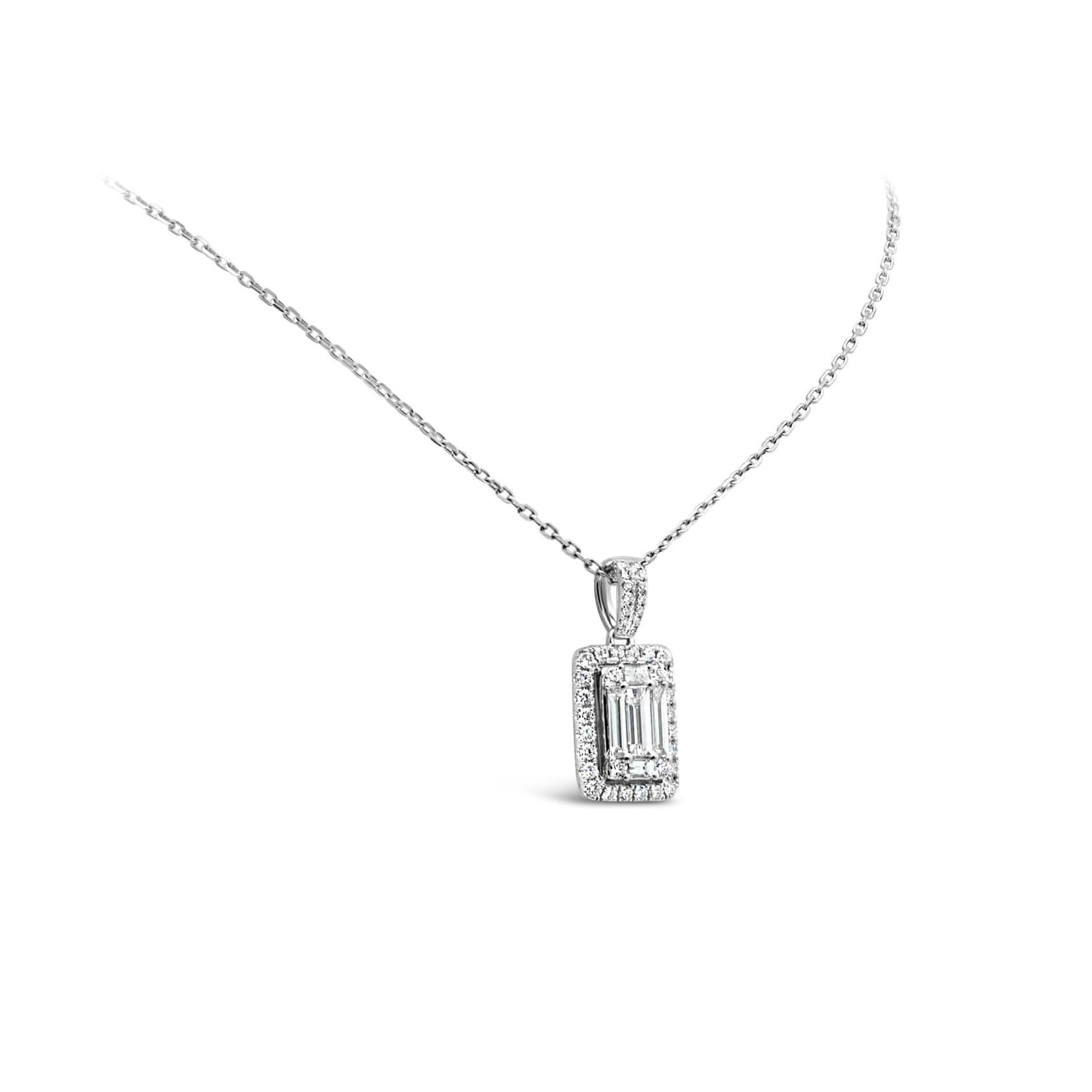 A beautiful necklace, showcasing baguette diamonds connected to look like a single large emerald cut diamond surrounded by a diamond halo on an accented bale and suspended on an 18K white gold chain. The diamonds weigh 1.25 carats total. 

Roman