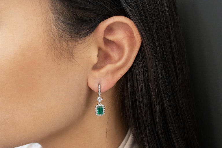 Contemporary Roman Malakov Colombian Emerald and Diamond Halo Dangle Earrings For Sale
