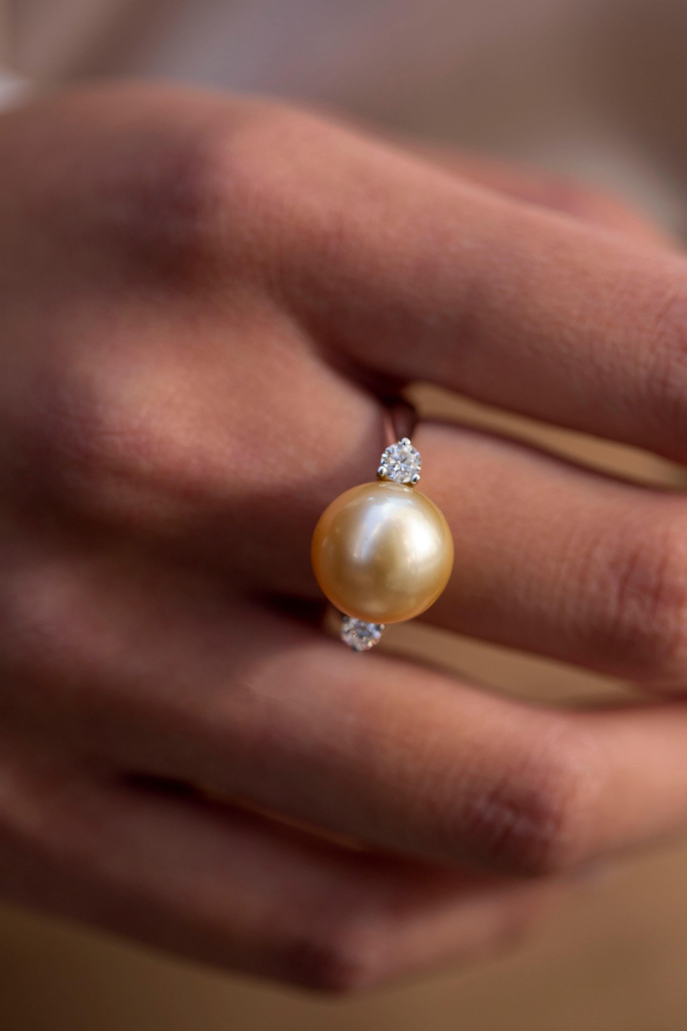 diamond ring with pearl side stones