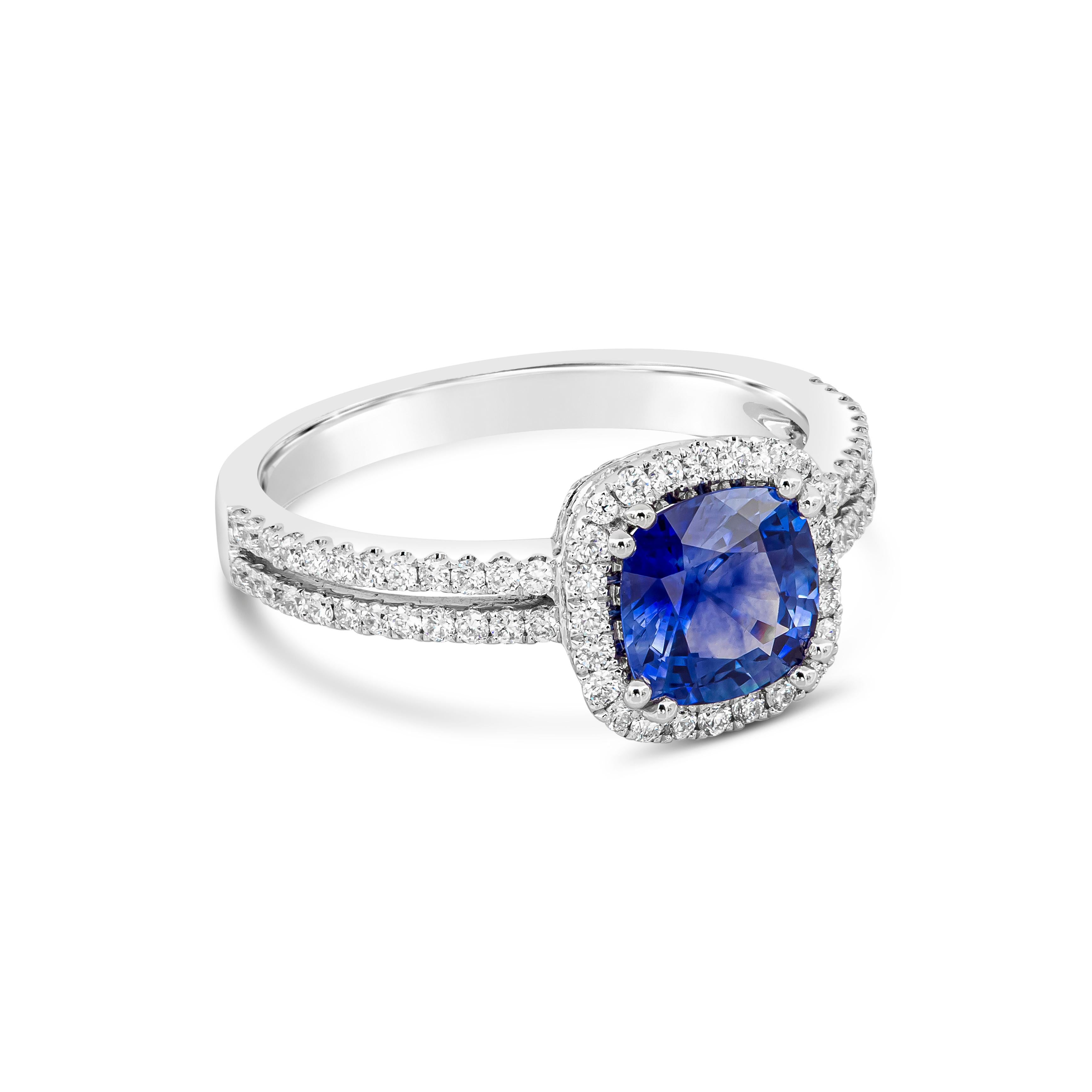 A timeless piece featuring a vibrant cushion cut blue sapphire weighing 1.35 carats, surrounded by a row of round brilliant diamonds. Set in a diamond encrusted double-row shank made in 18k white gold. Diamonds weigh 0.48 carats total.

Style