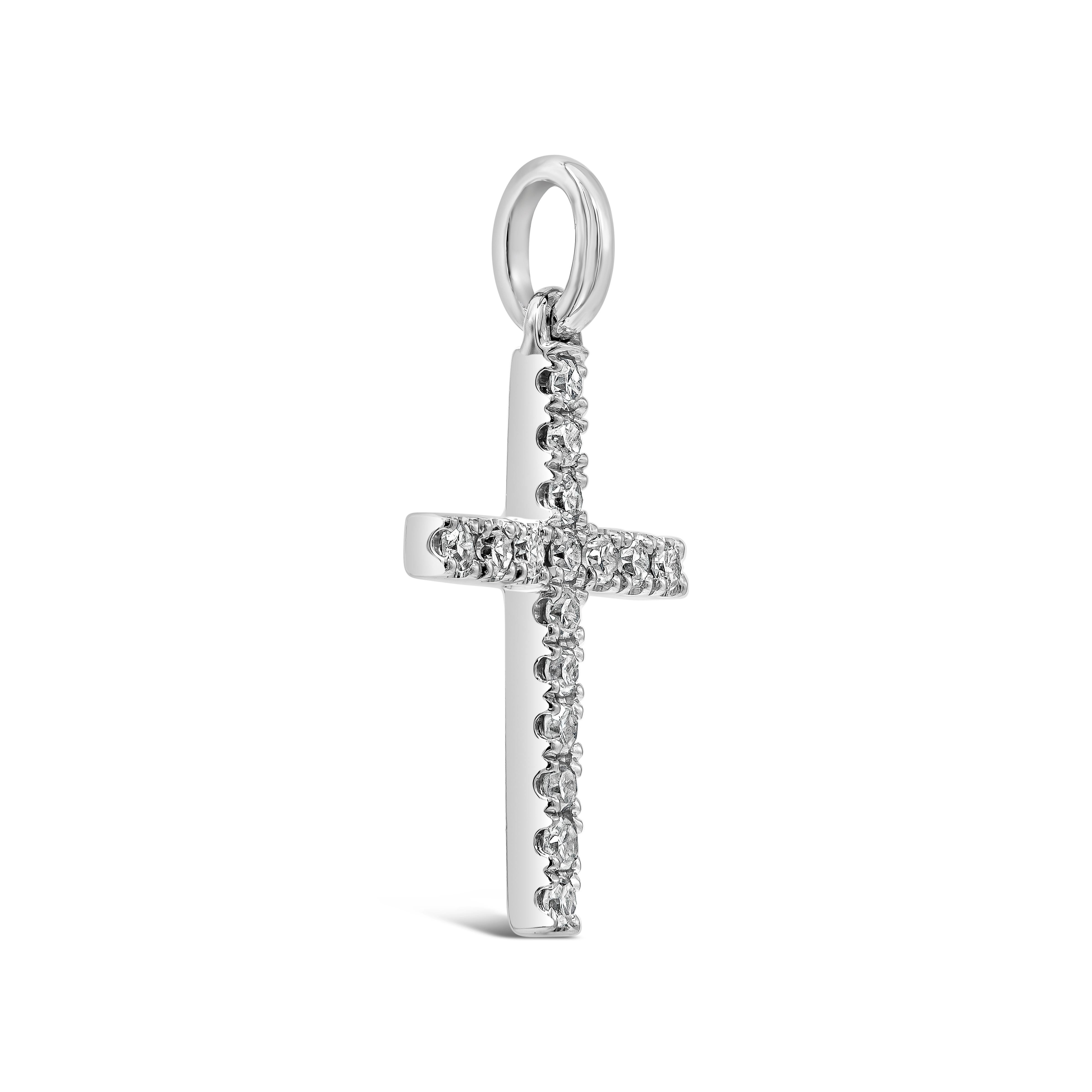 A small pendant necklace showcasing 0.08 carats total of single cut diamonds, set in a religious cross design. Made in 18k white gold. Suspended in an 16 inch white gold chain.

Style available in different price ranges. Prices are based on your