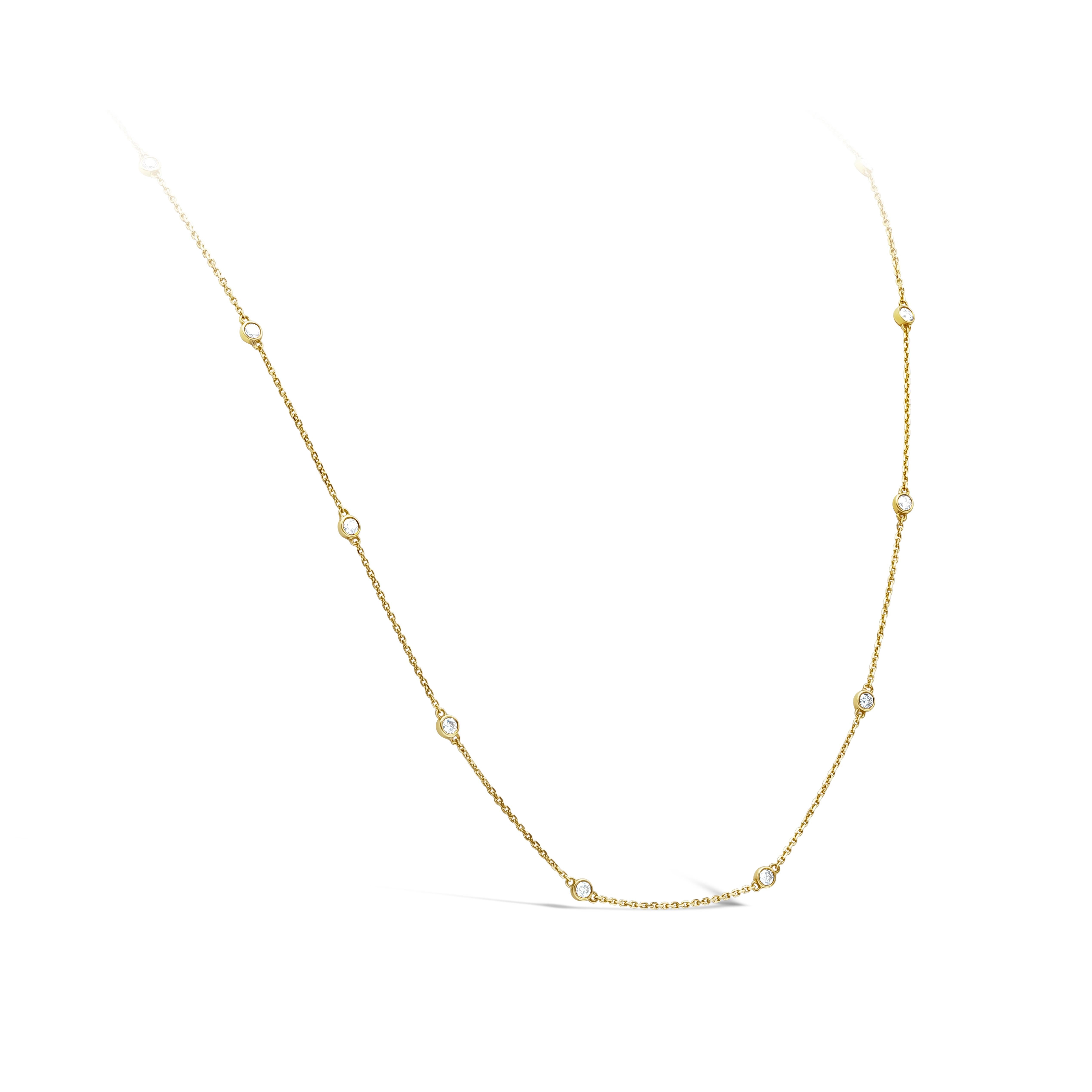 A simple yet classic necklace that packs a lot of sparkle; a line of brilliant diamonds bezel set in 18k yellow gold are perfectly spaced for that delicate and feminine look and finish. Diamonds weigh 1.70 carats total. Approximately 18 inches in
