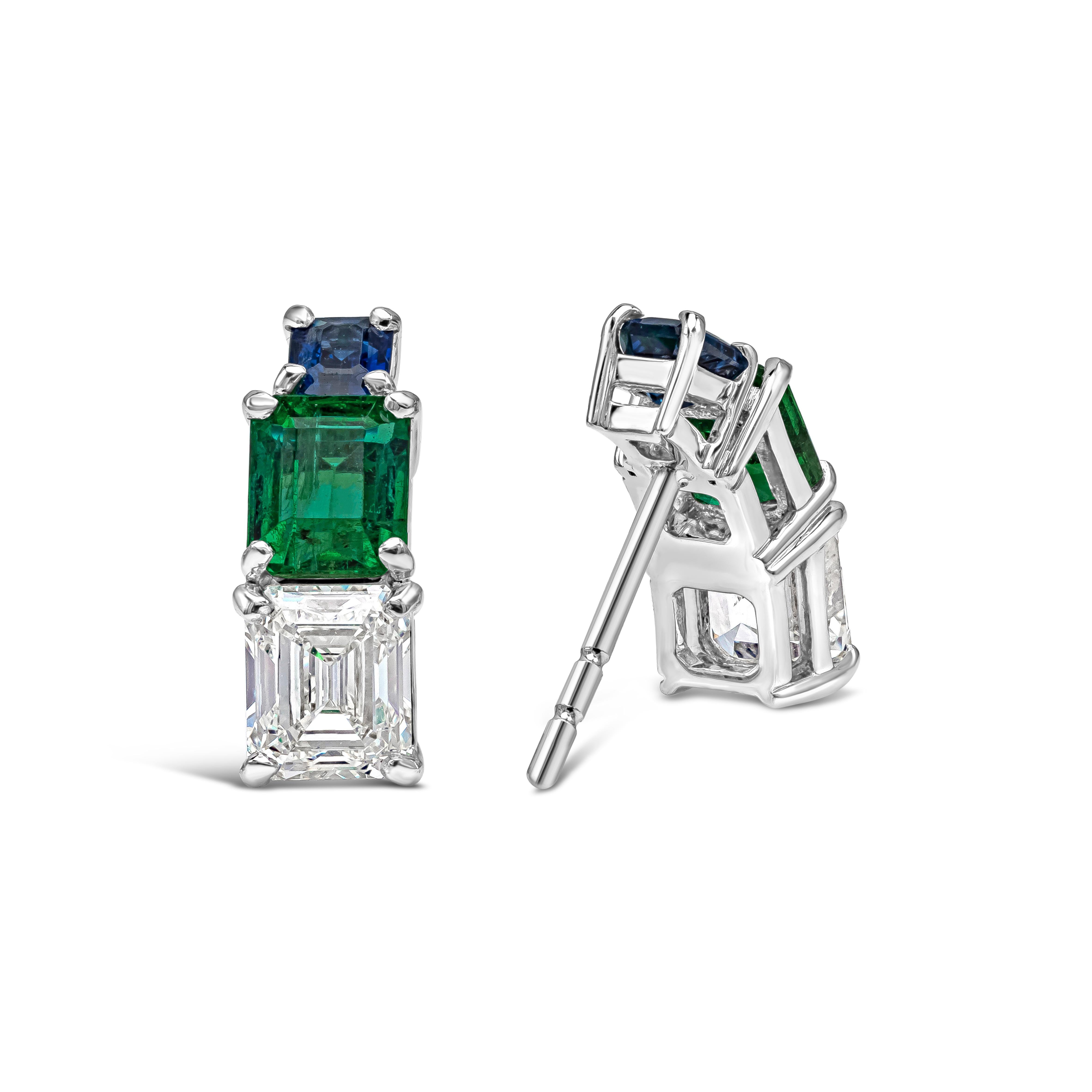 A beautiful and intricately designed jewelry showcasing two emerald cut diamonds weighing 0.72 carats and 0.75 carats respectively, each accented by a green emerald and blue sapphire. Set in a semi-hoop mounting made in 18k white gold. Emeralds